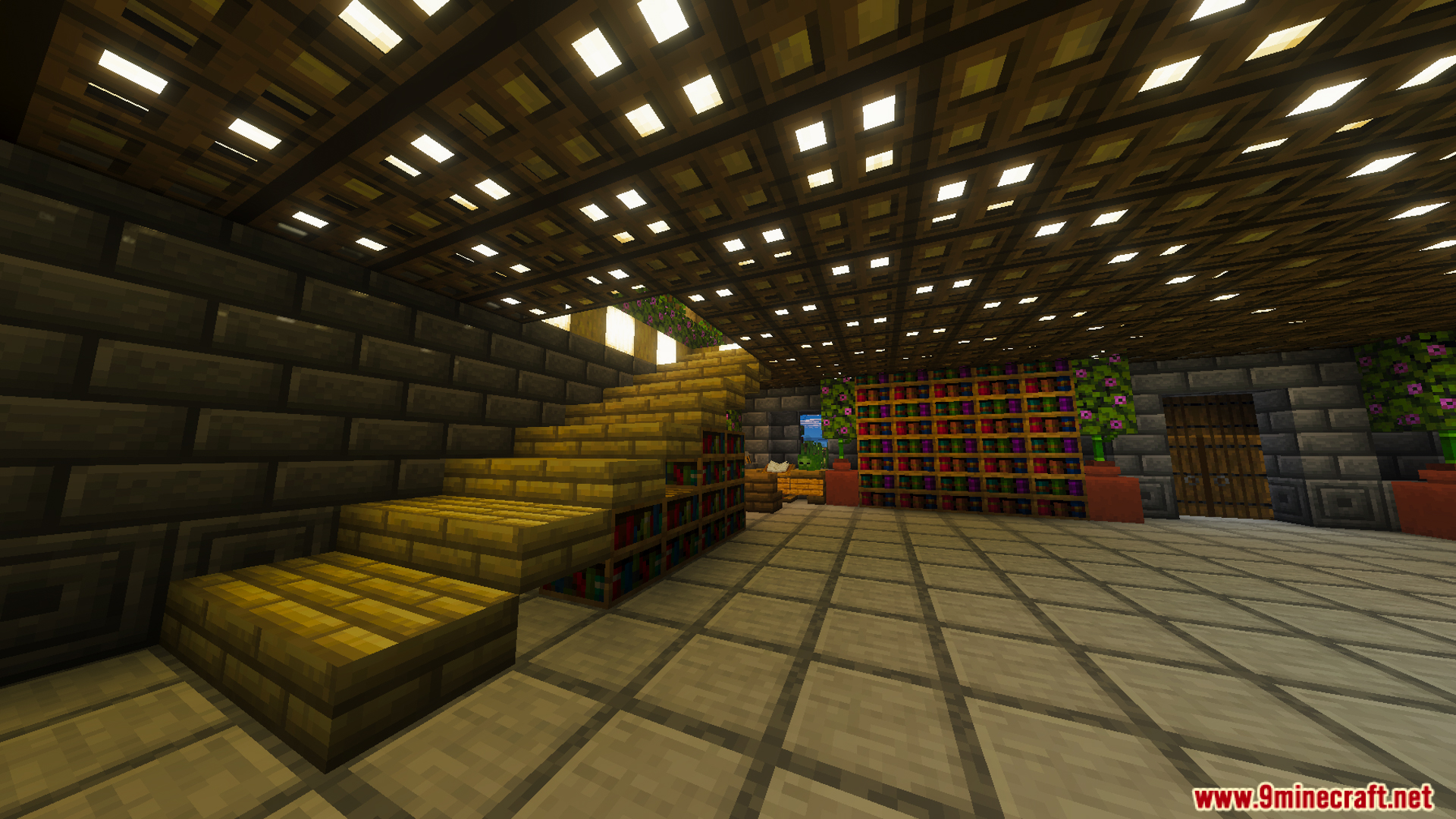 A large room with a wooden staircase and bookshelves