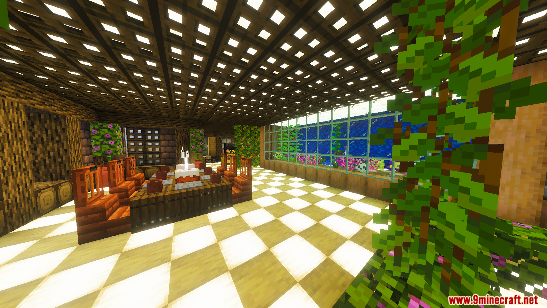 A dining room with a large aquarium and bamboo furniture