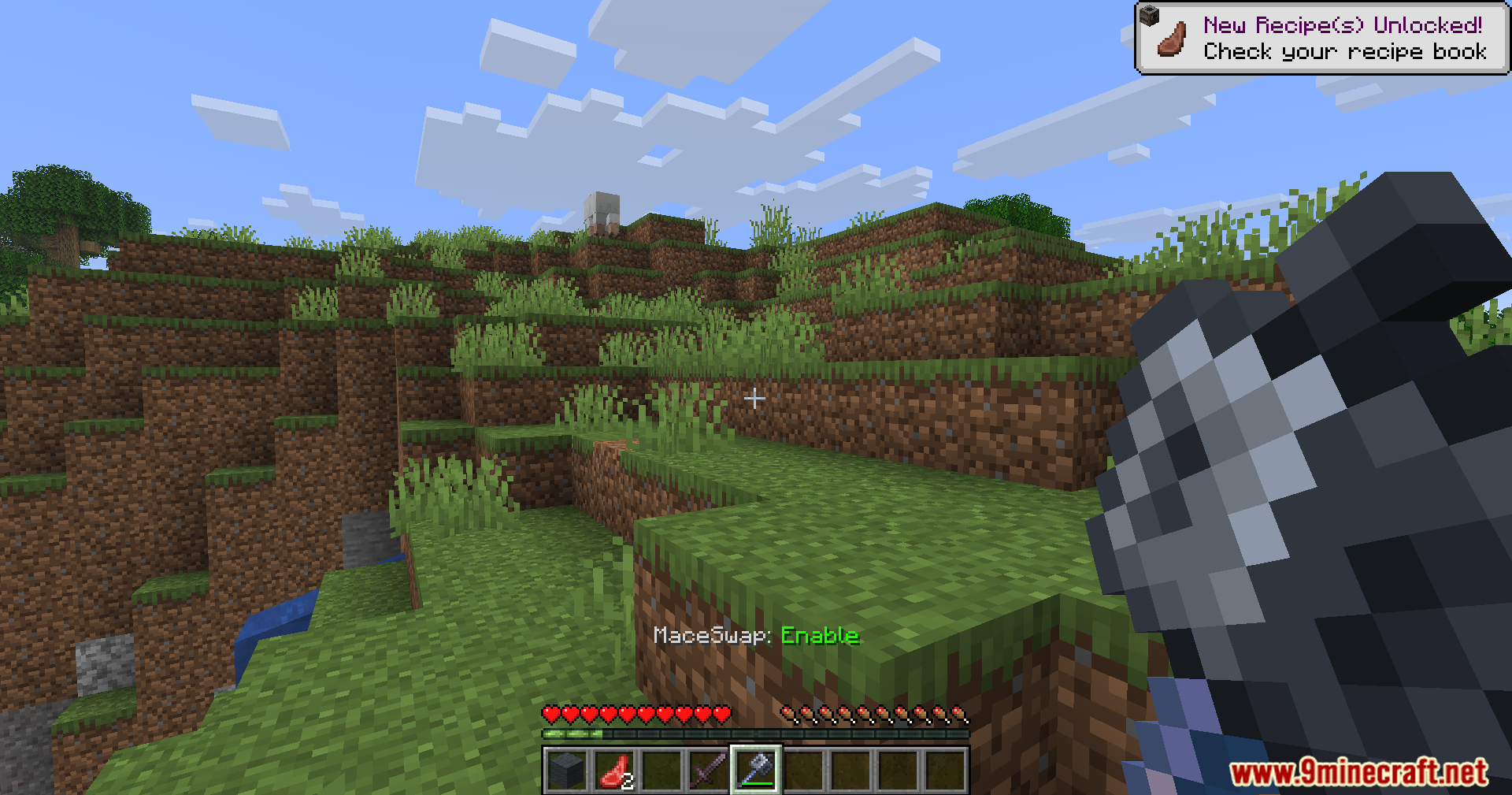 Player holding a mace with MaceSwap enabled text on screen