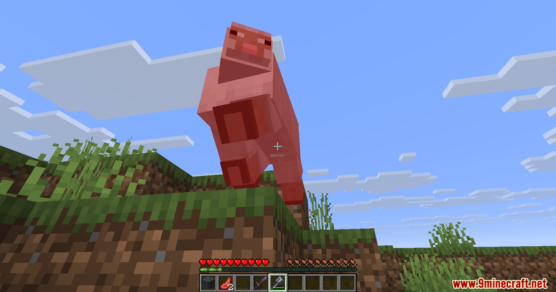 Player hitting a pig mid air demonstrating the automated mace combat feature