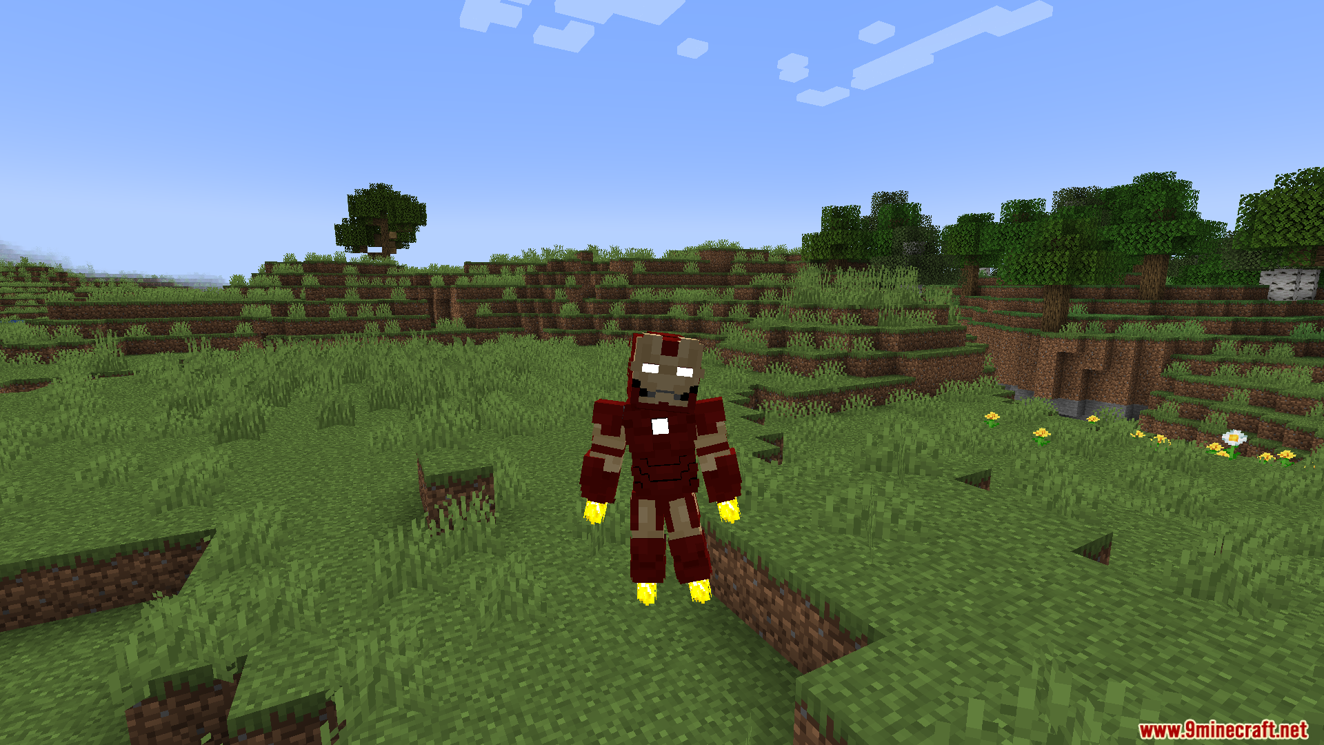 Player wearing red and gold powered armor hovering in a grassy plains biome