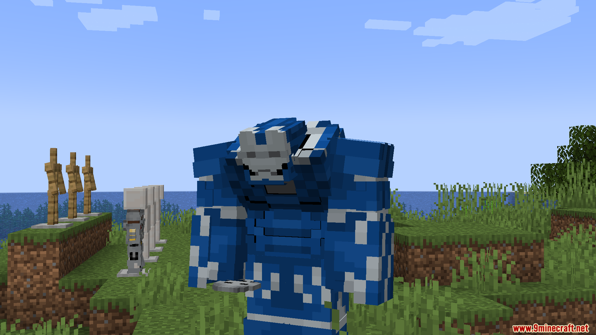 Player wearing the bulky blue Igor armor suit in a grassy field