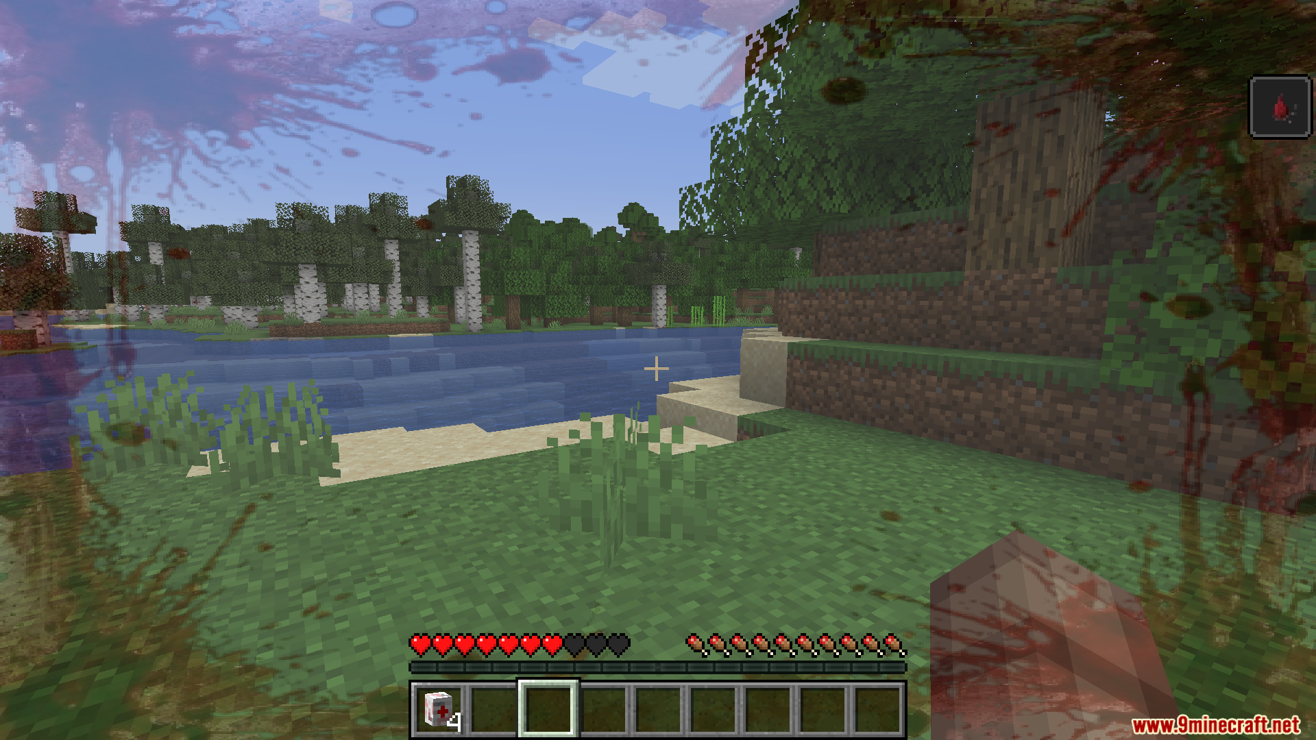 TaCZ Bleeding Mod Screenshot 3 Player with blood overlay on screen holding a medical bandage item