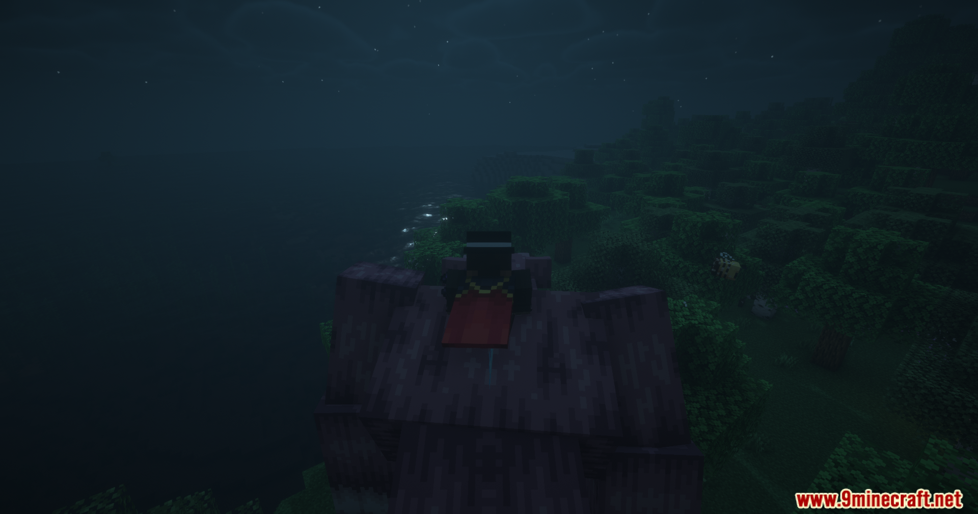 Tensura Better Subordinates Mod Screenshot 5 Minecraft character with a red cape standing on a dark structure at night