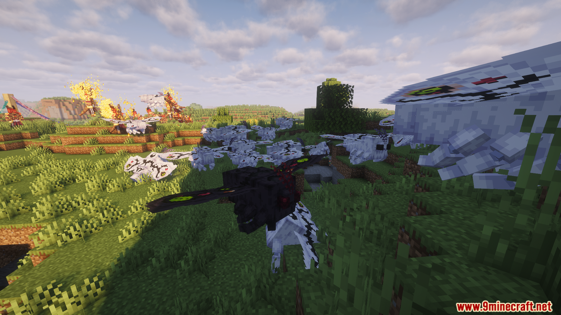 A swarm of winged monsters in a grassy biome