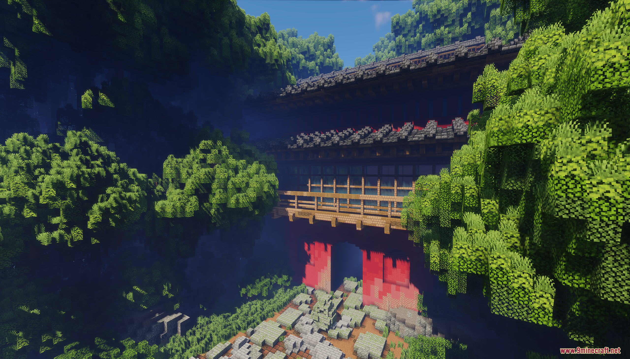 Angled view of the grand red gate structure and wooden balcony