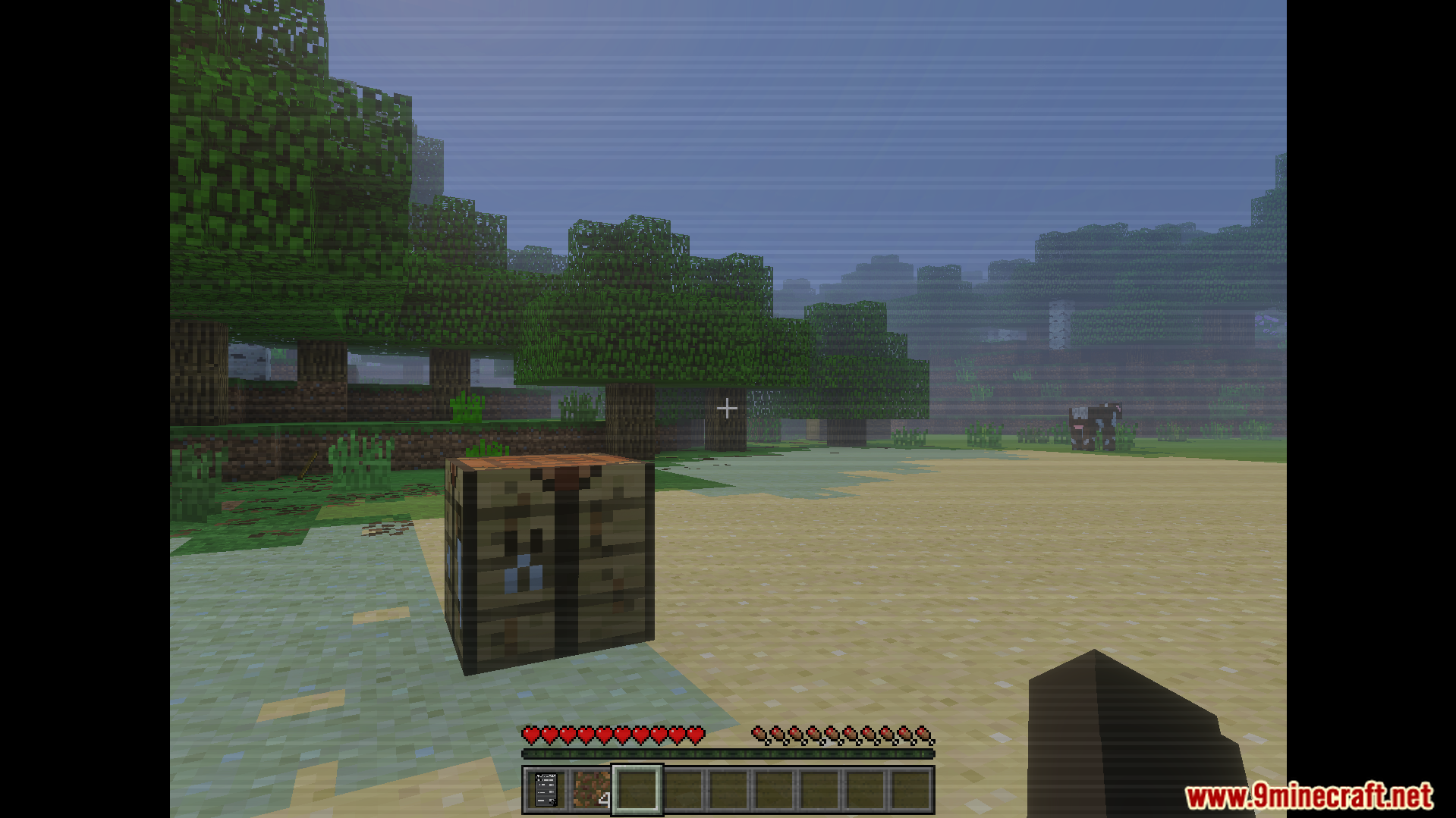 The Shattered Command Addon Screenshot 4 exploring the survival world with a crafting table and creepy vhs overlay