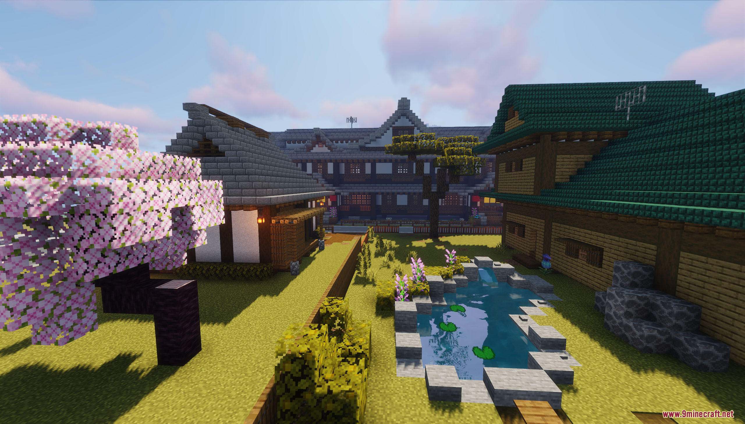 Traditional Japanese houses surrounding a garden with a pond
