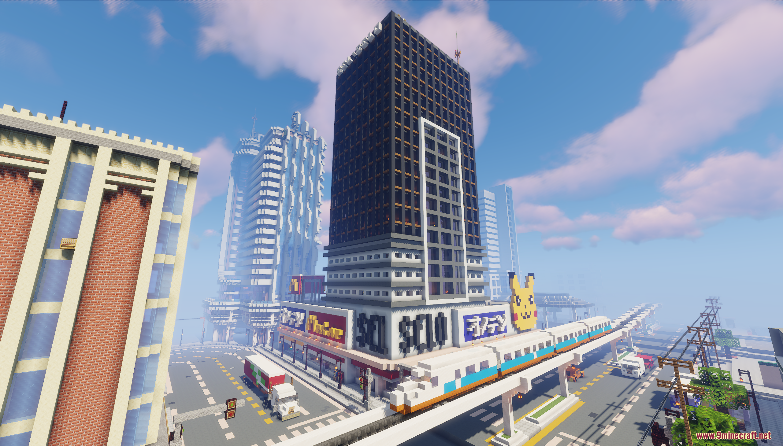 A modern city with a skyscraper and elevated train