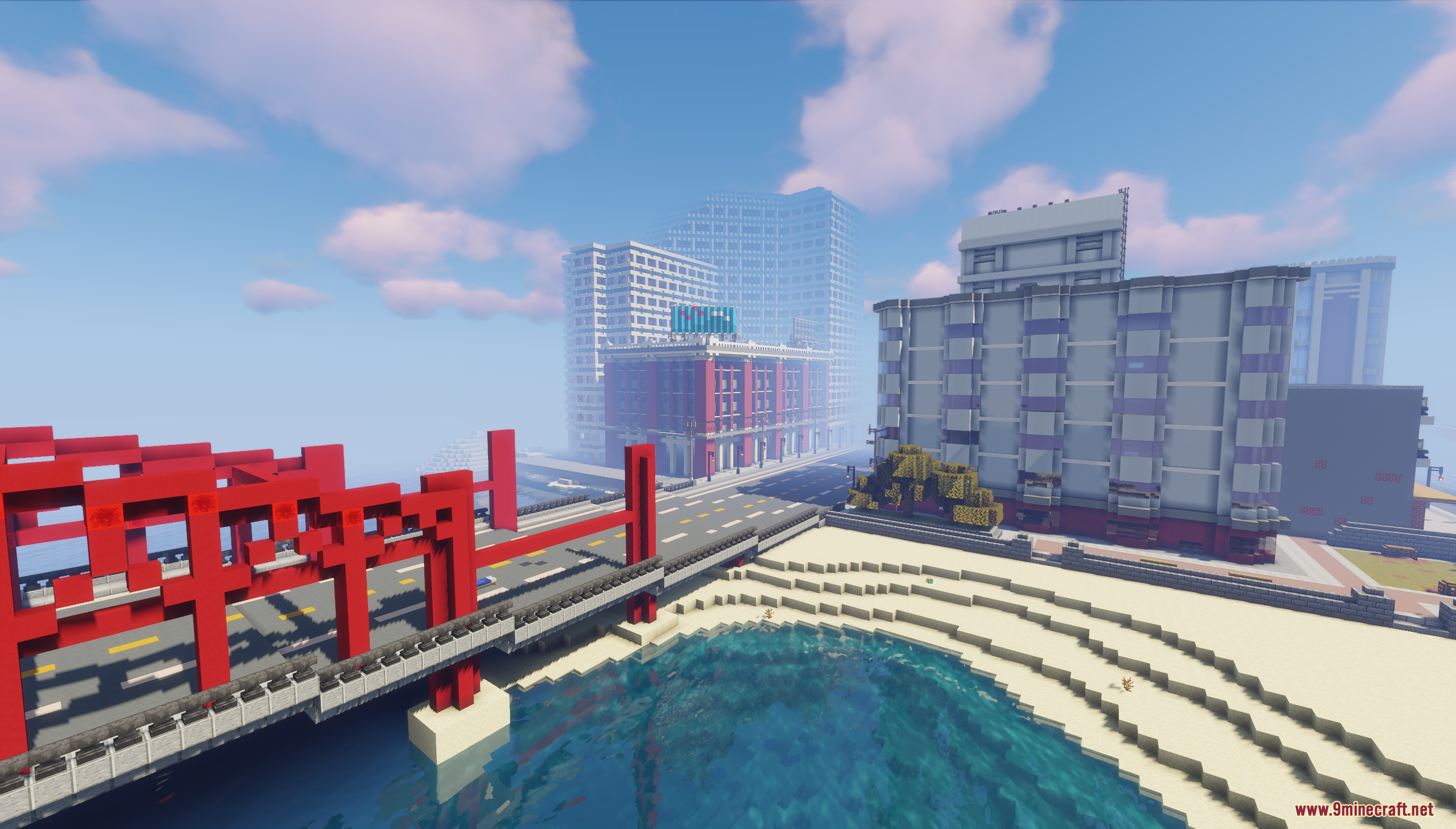 A large red bridge over water next to the city