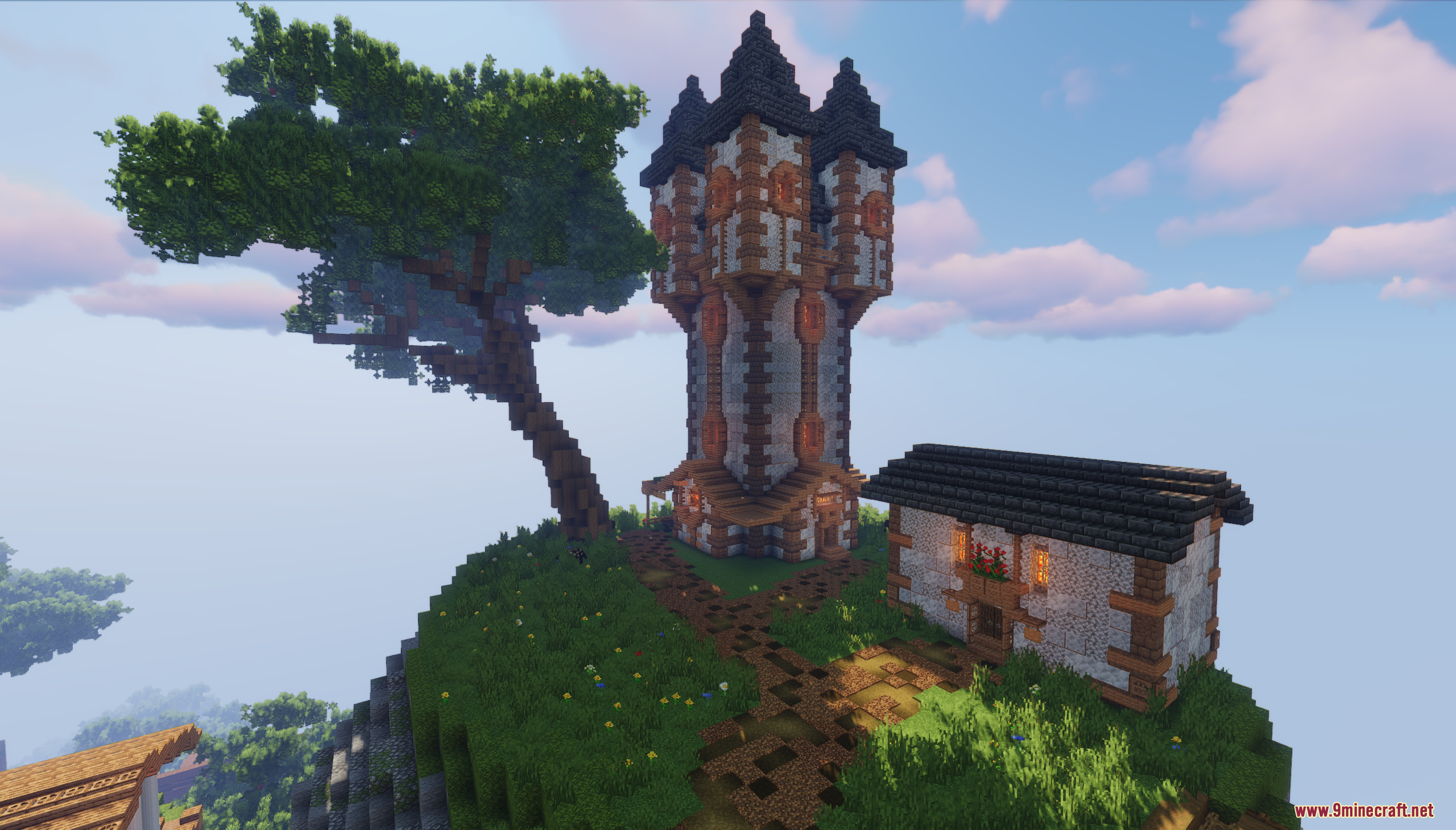 A tall medieval fantasy tower next to a small cottage