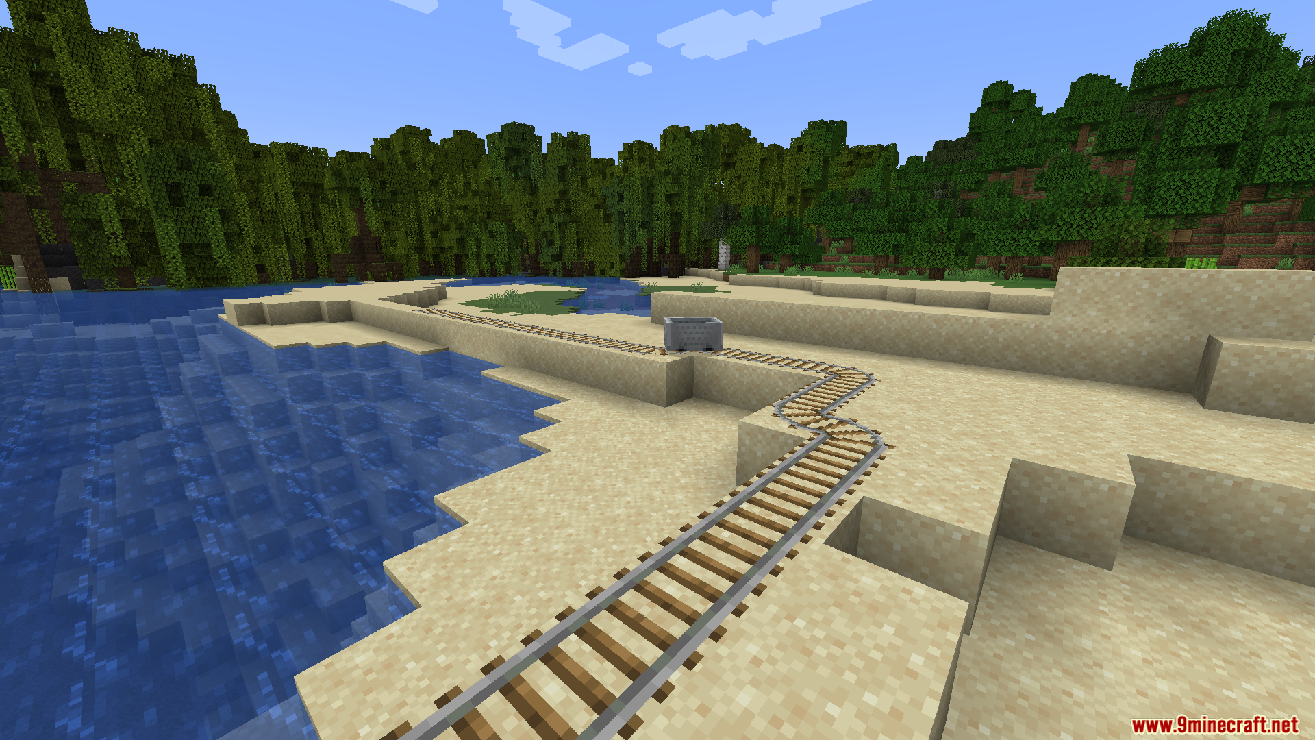Minecart track running along a sandy beach shoreline