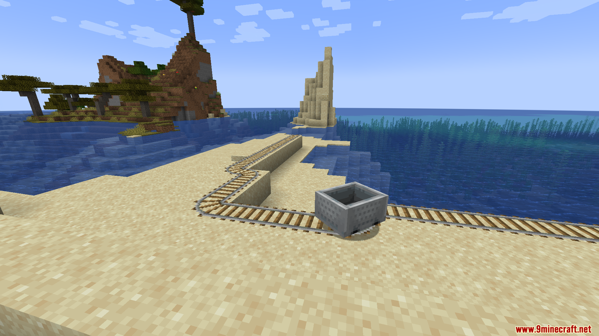 Minecart track built on a small sandy island