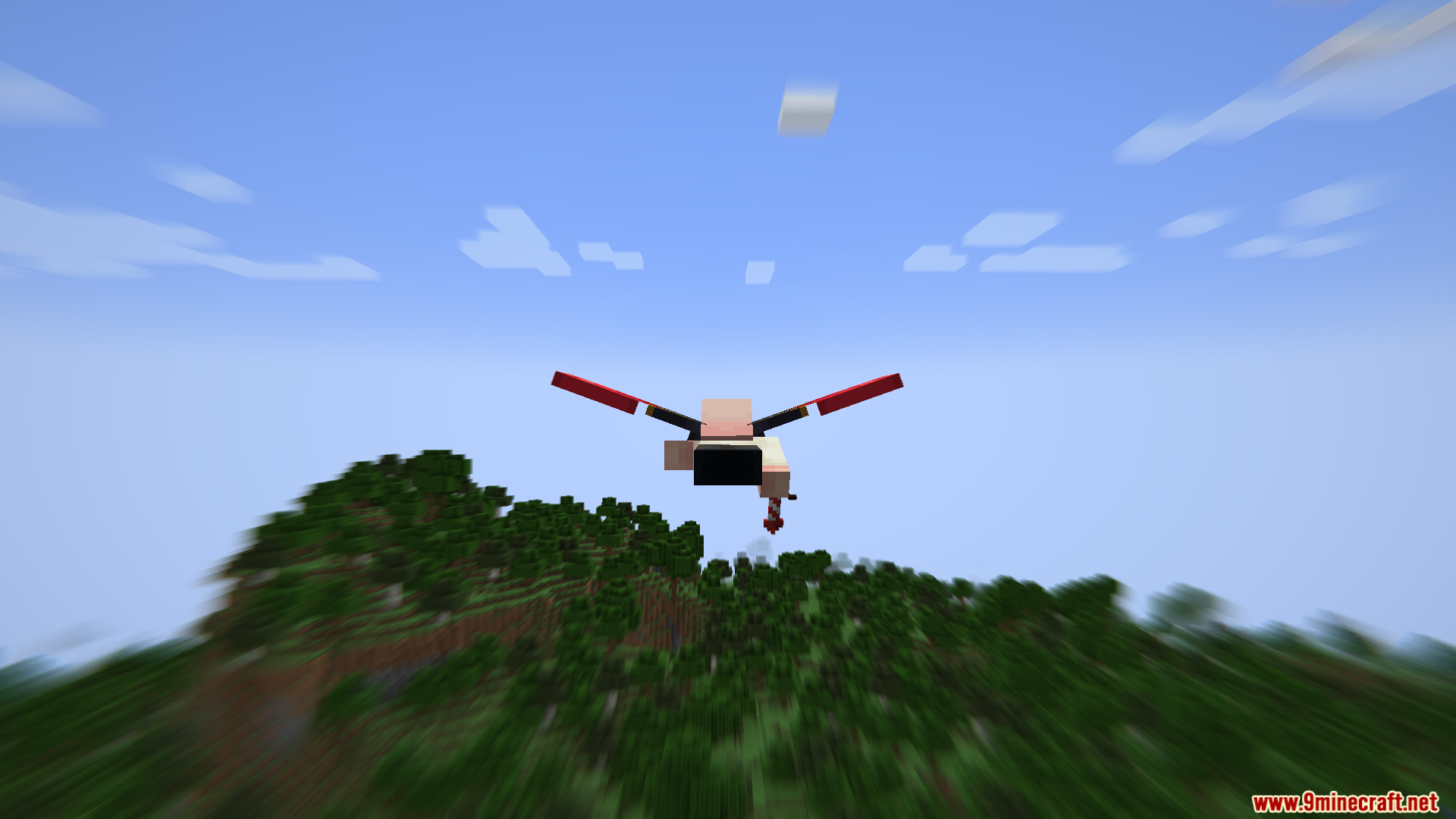 Player with red elytra flying over a blurred forest