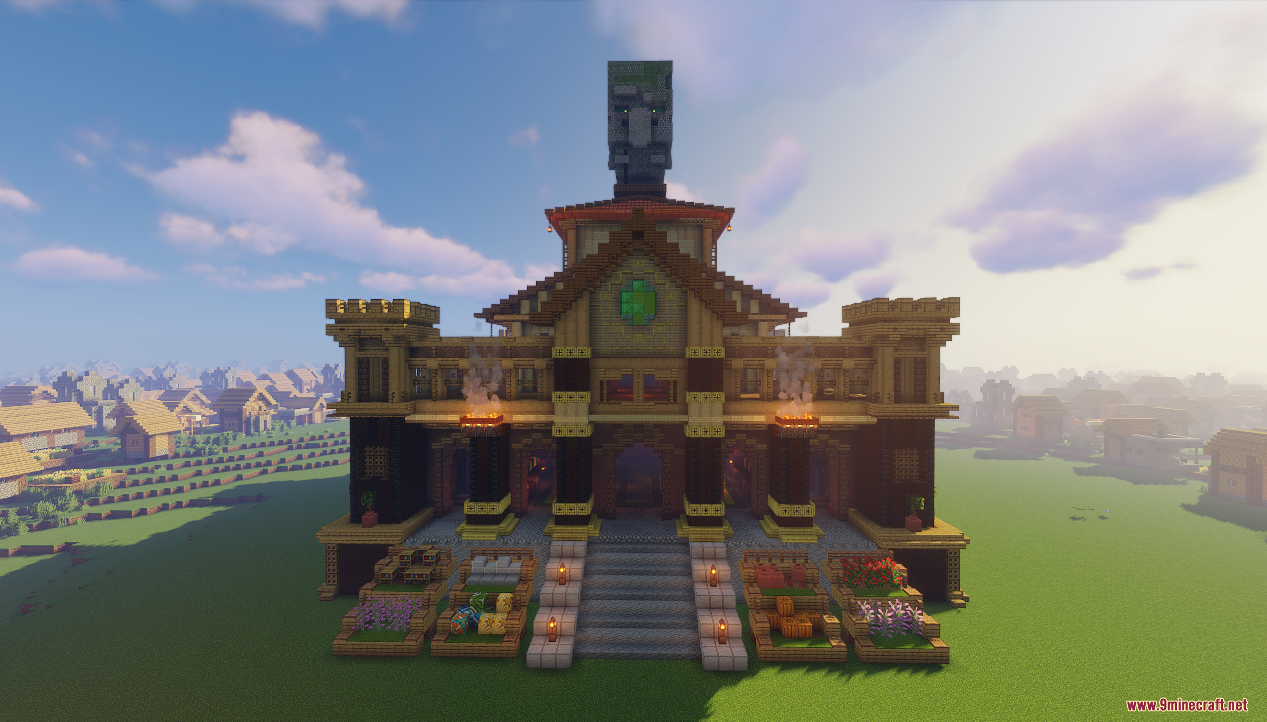 Front view of a large villager trading hall with a giant head statue