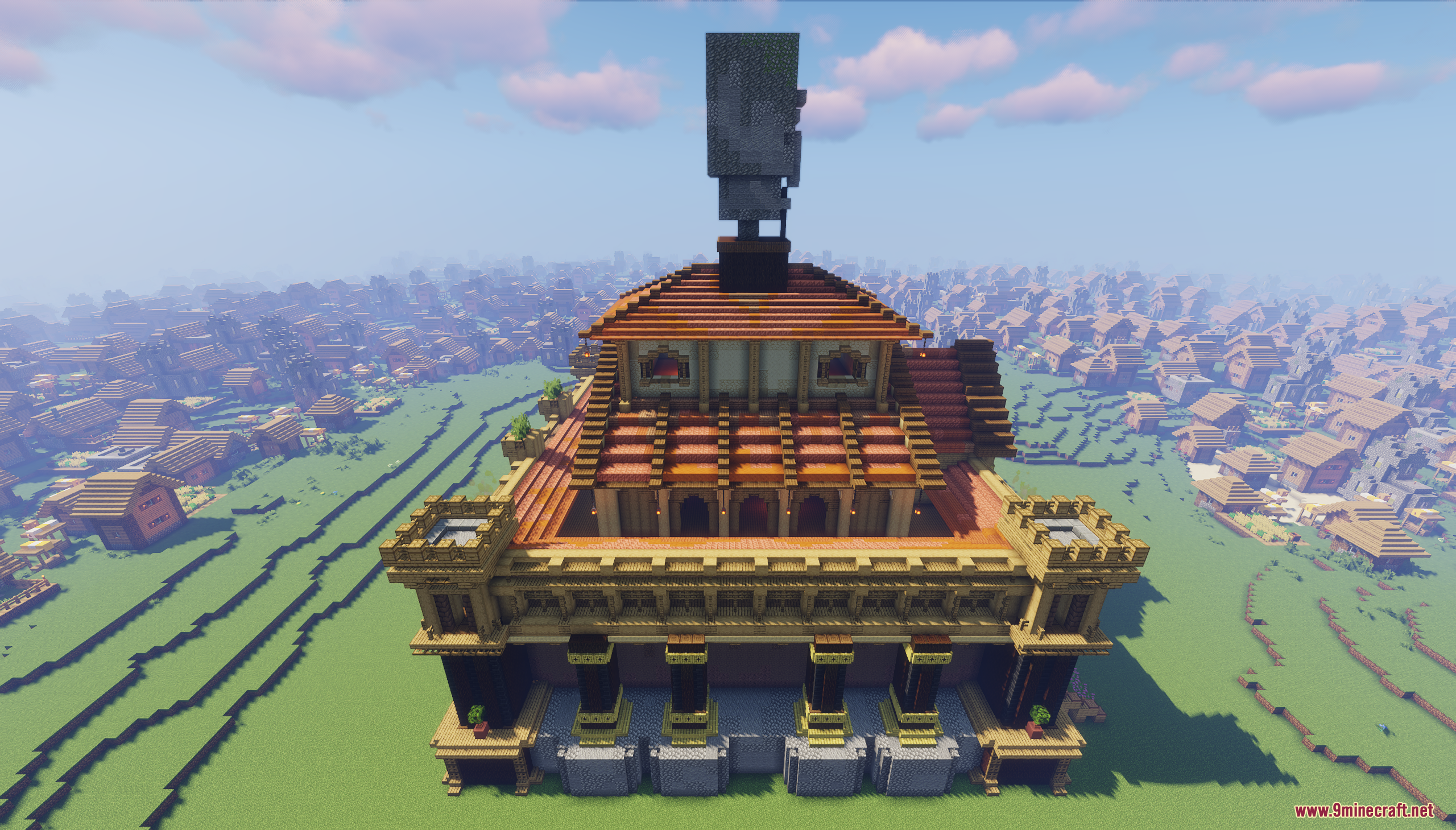 Large temple structure topped with a giant villager head statue in a village