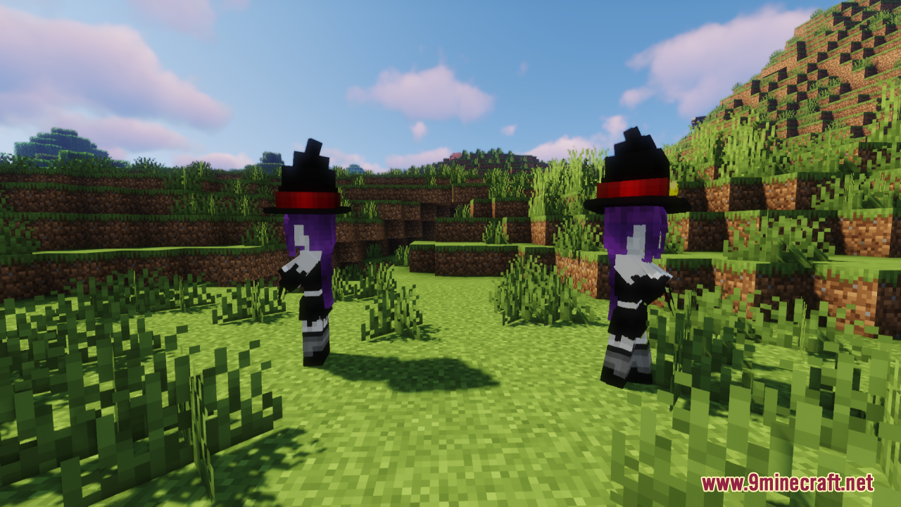 Two witch girl characters standing in a grassy field