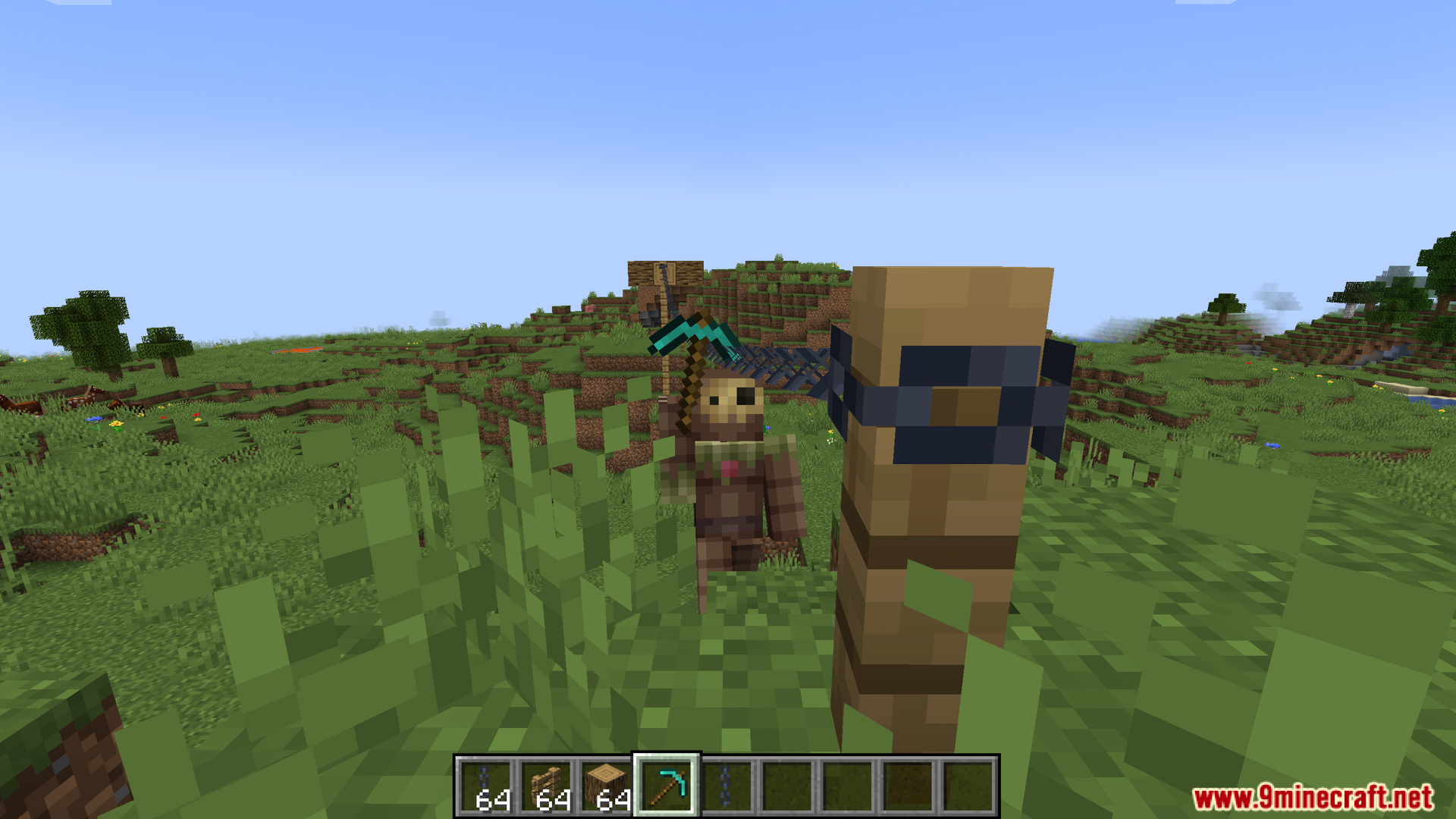 A scarecrow with a pickaxe next to a zipline post