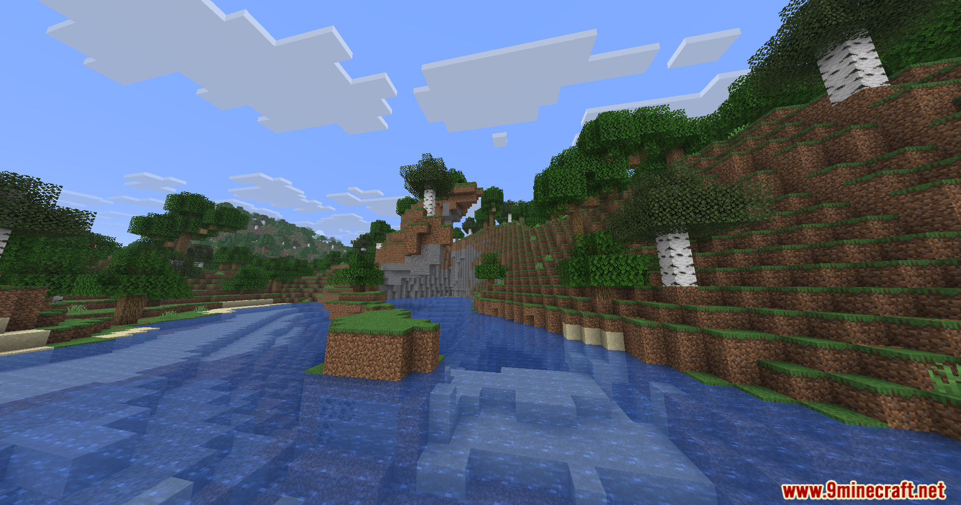 A scenic river flowing through a lush forest with birch and oak trees