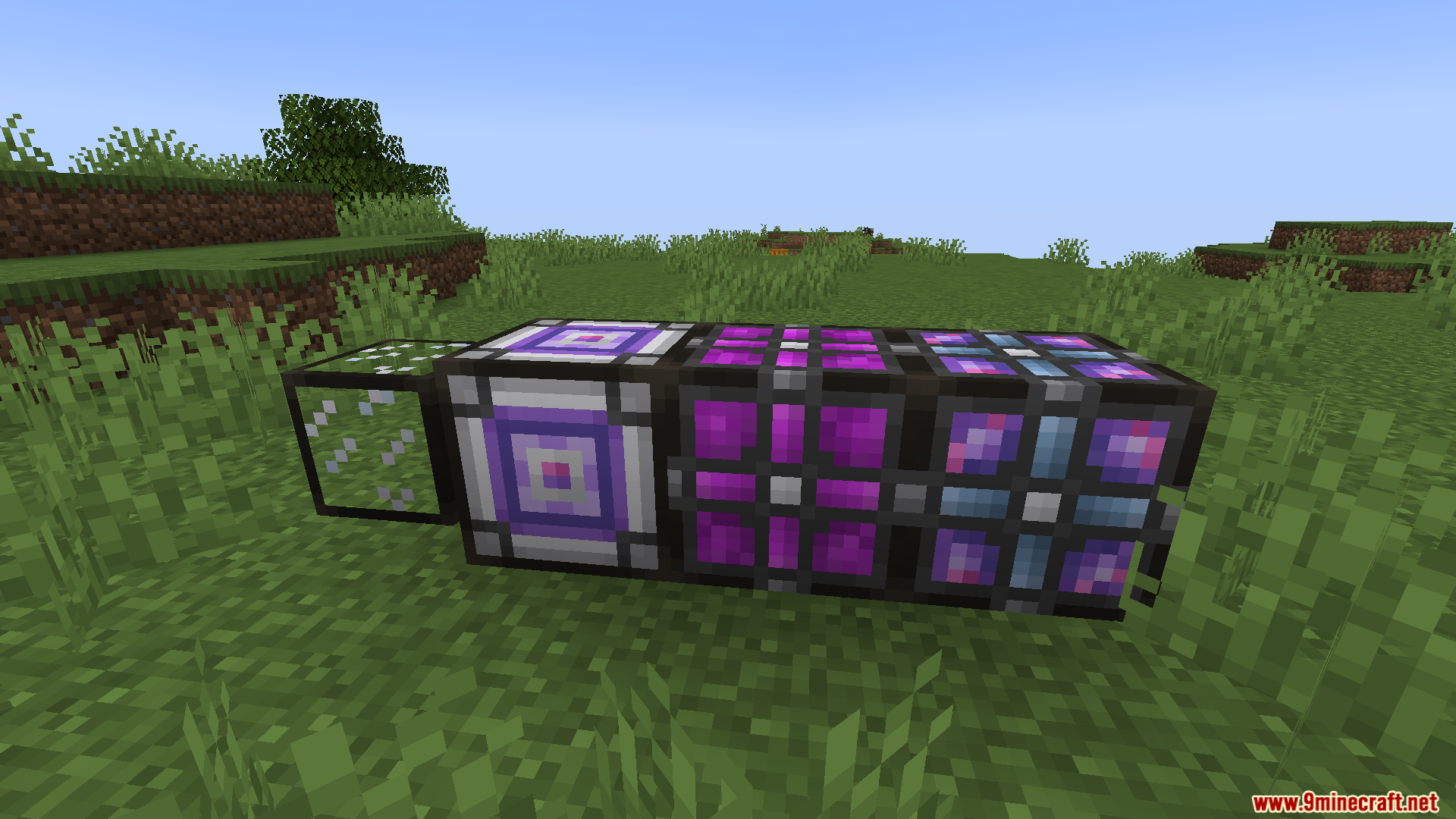 Various custom machine blocks from the AE2 Addon Lib mod on grass