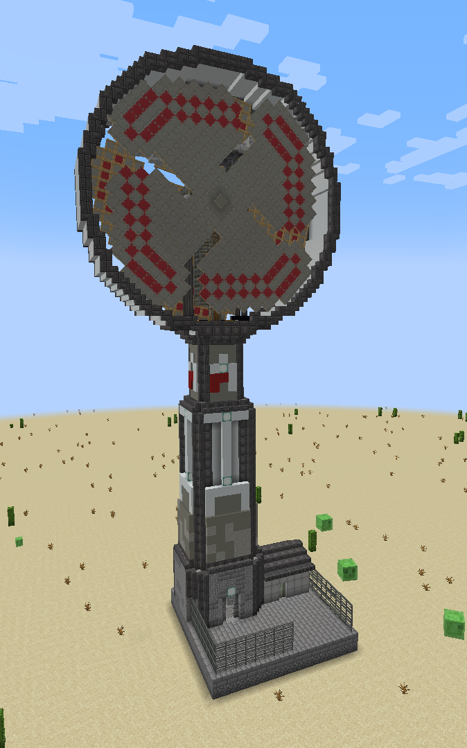 A massive brutalist windmill tower with red patterns in a desert landscape