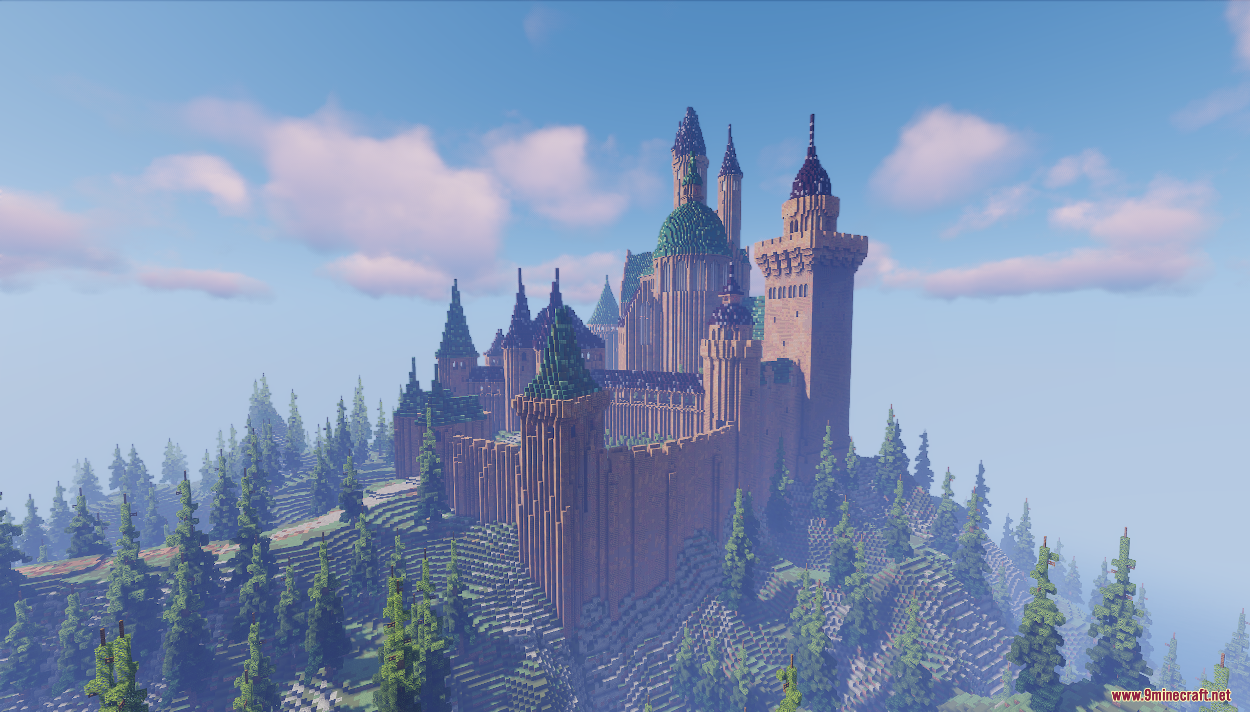 A massive medieval fortress with green roofs sits atop a lush pine hill