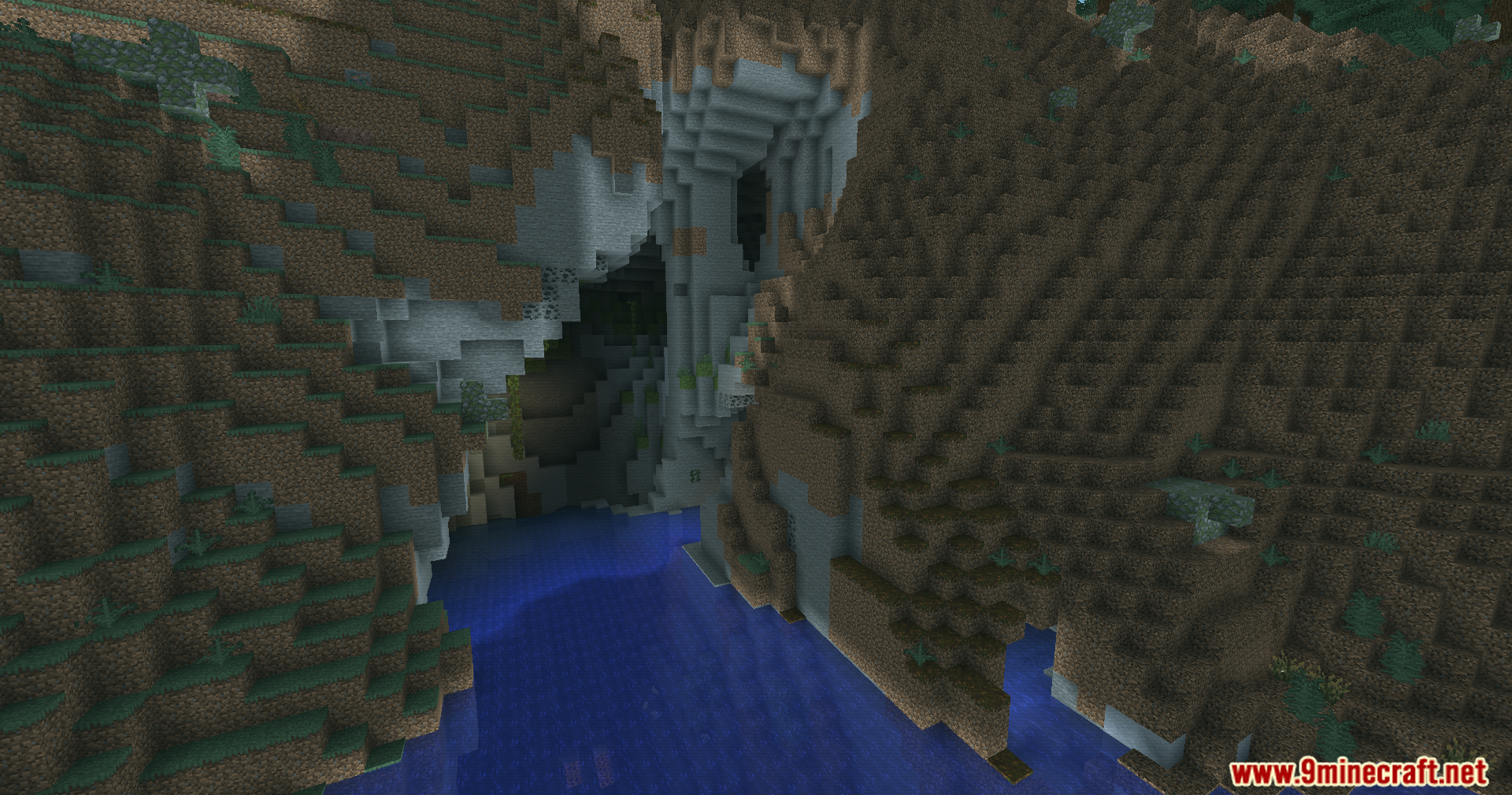 A dark cave entrance and rocky cliffs overlooking blue water with teal lighting