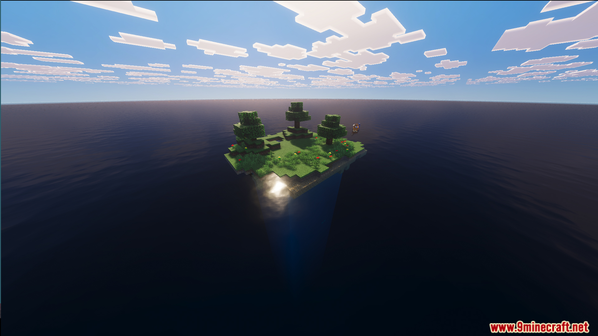 Aerial view of a tiny island in the middle of the ocean