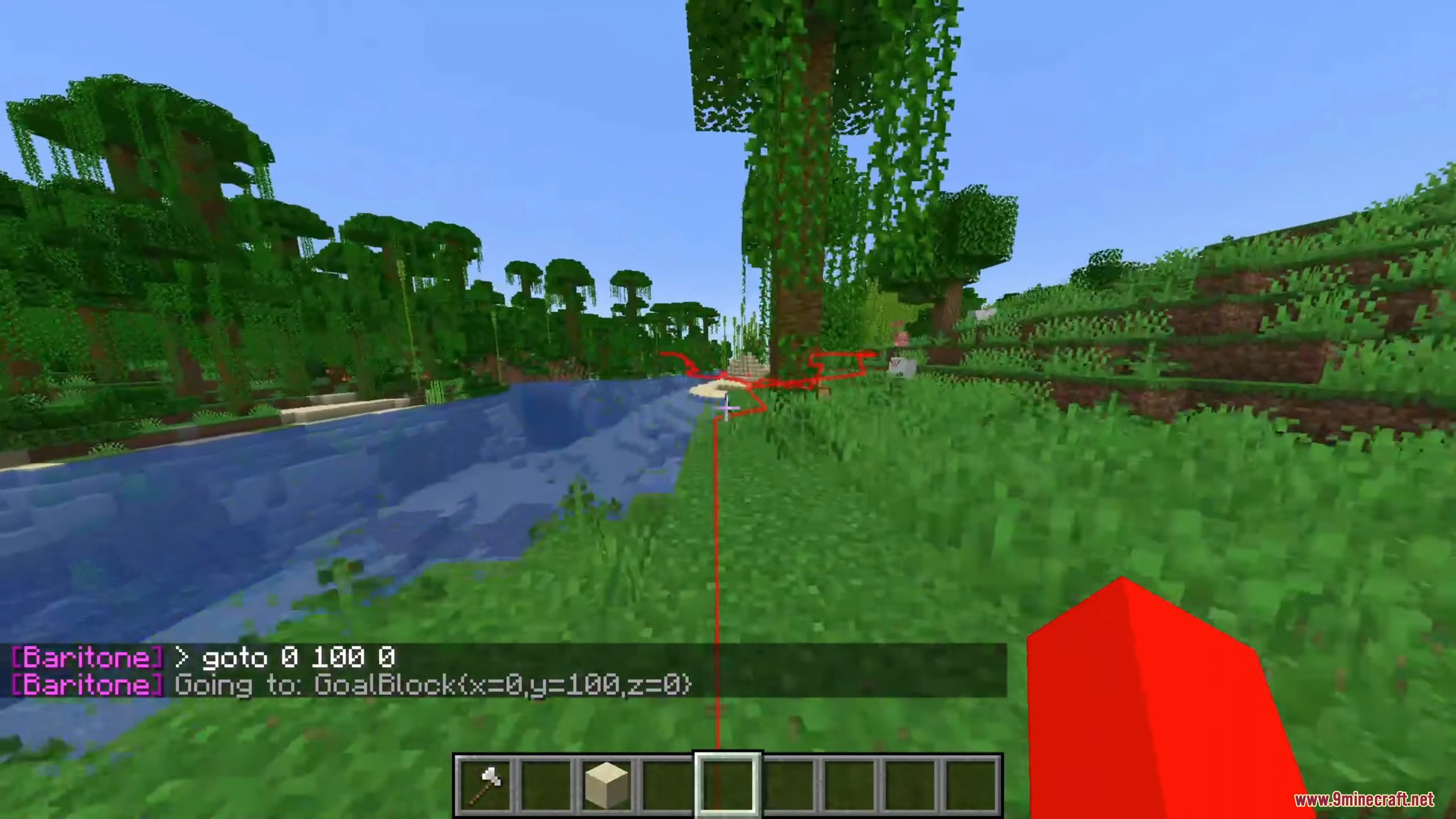 A red pathfinding line plots a route through a lush jungle landscape.