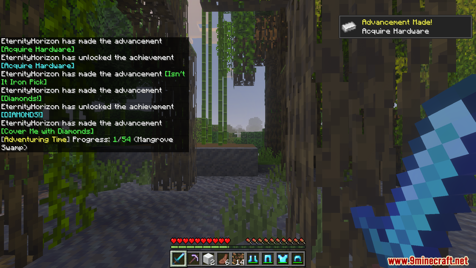 Player receives advancement notifications and chat alerts while exploring a mangrove swamp