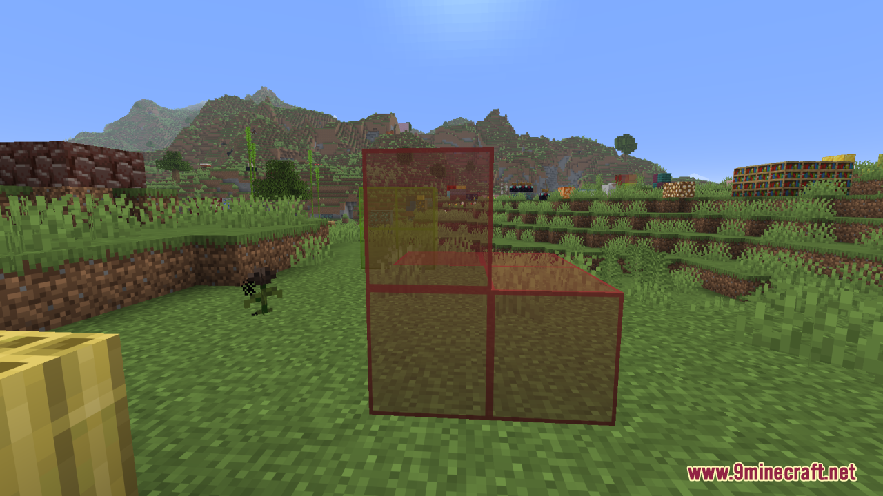 Better Clearer Glass Resource Pack Screenshot 10 Transparent red stained glass blocks placed on a grassy field in Minecraft