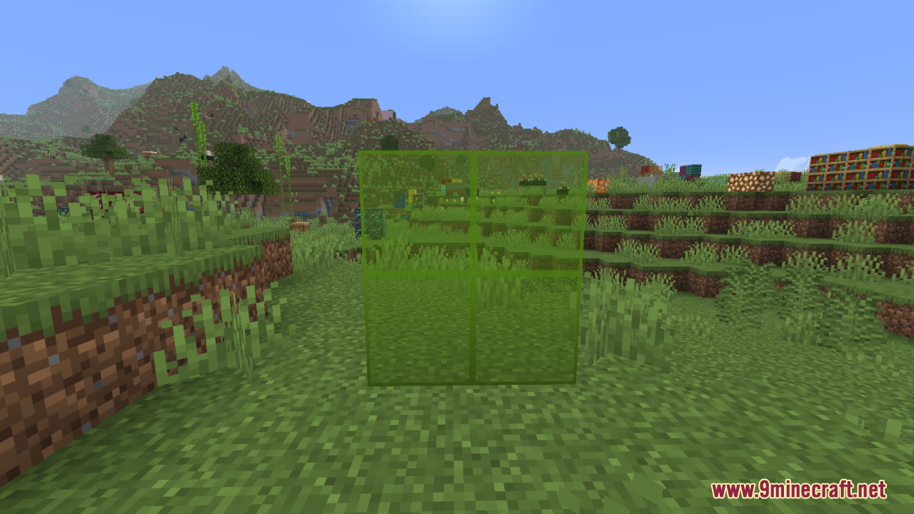 Better Clearer Glass Resource Pack Screenshot 11 Four green stained glass blocks with clear textures in a grassy field