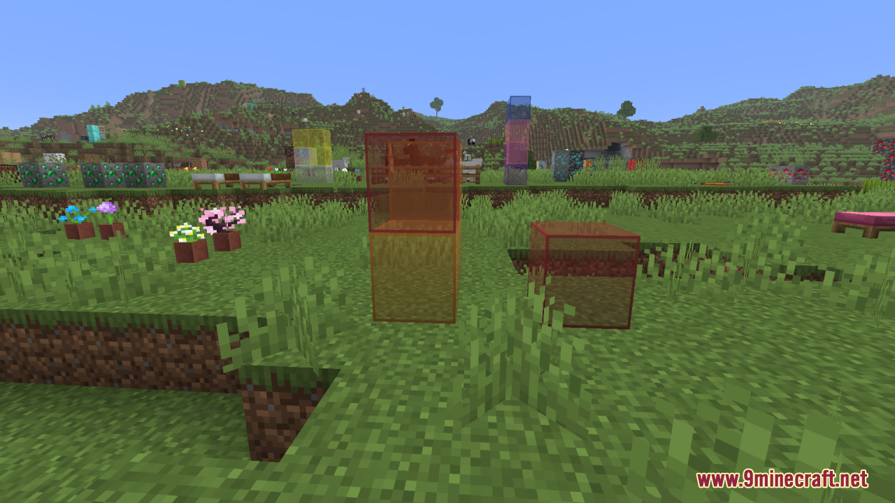 Better Clearer Glass Resource Pack Screenshot 14 Clear red and orange stained glass blocks in a grassy Minecraft field
