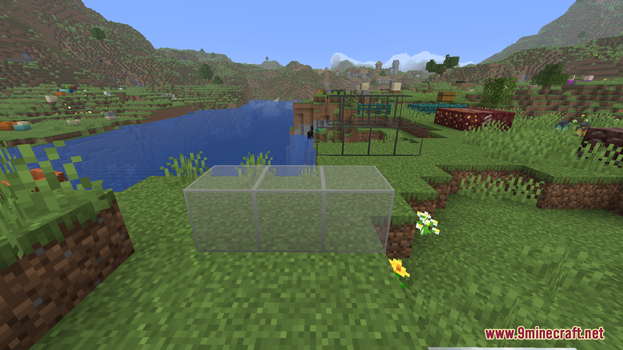 Better Clearer Glass Resource Pack Screenshot 9 Three clean glass blocks with clear views placed on a grassy hill