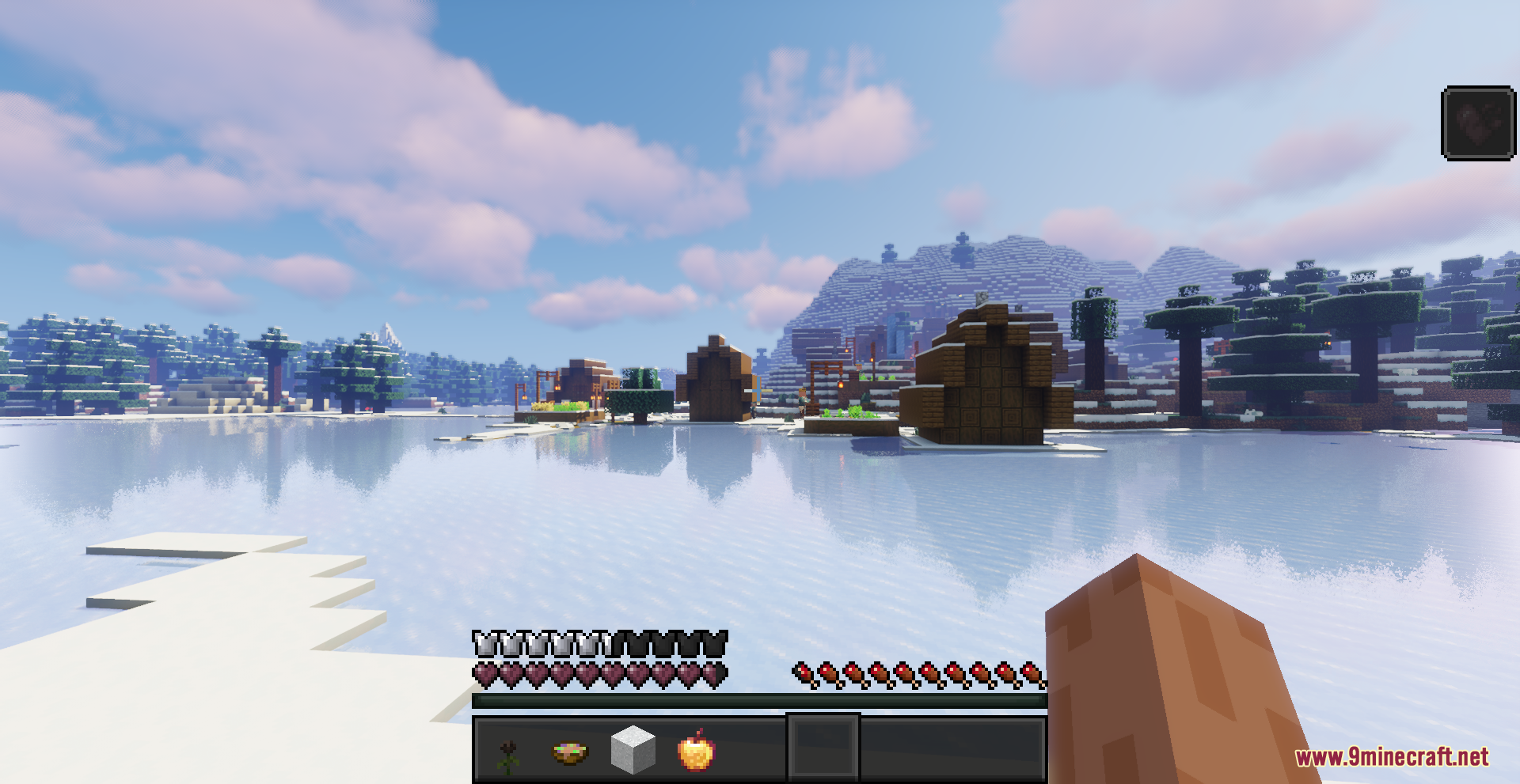 Beyond Huds Resource Pack Screenshot 5 A snowy landscape with wooden houses and a dark custom hotbar interface