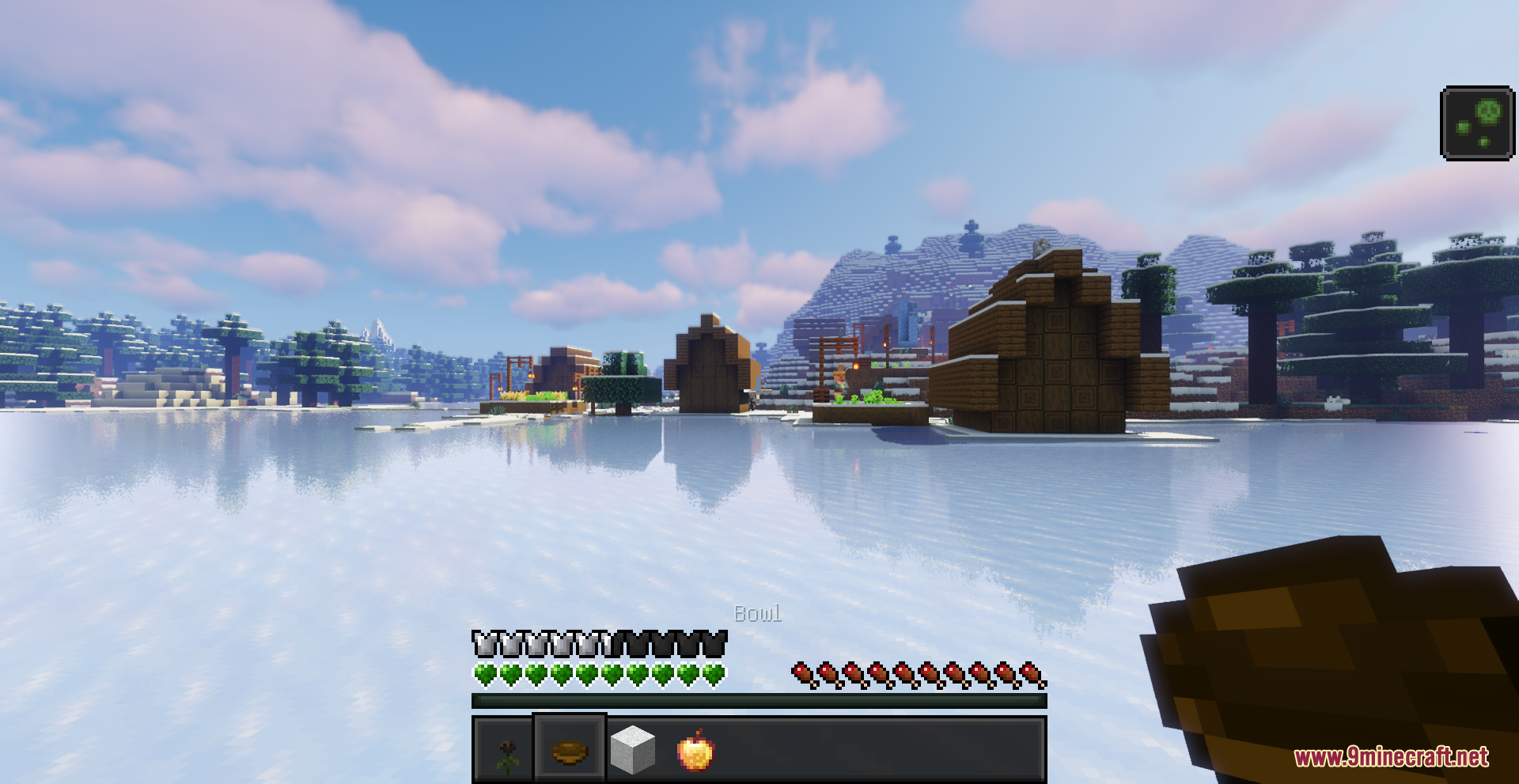 Beyond Huds Resource Pack Screenshot 6 Player holding a wooden bowl while standing on a frozen lake in Minecraft