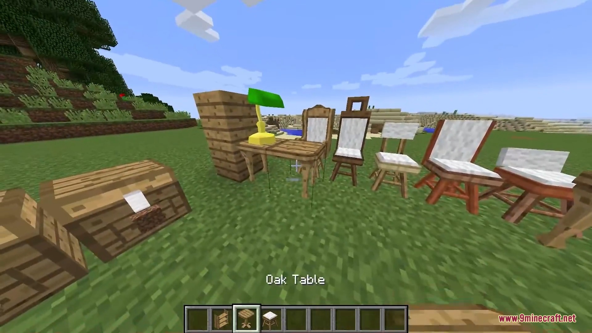 A variety of wooden furniture pieces including tables chairs and a lamp