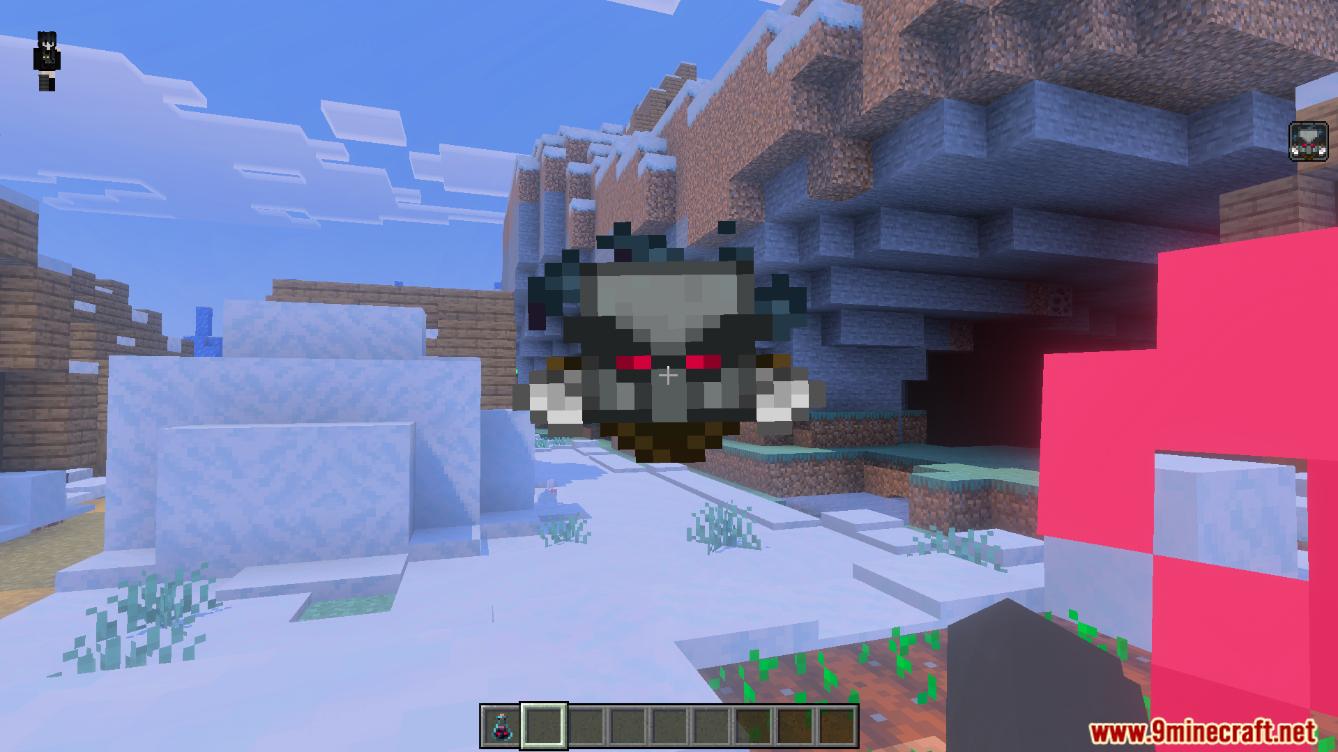 First person view of a snowy landscape with a custom raid boss icon