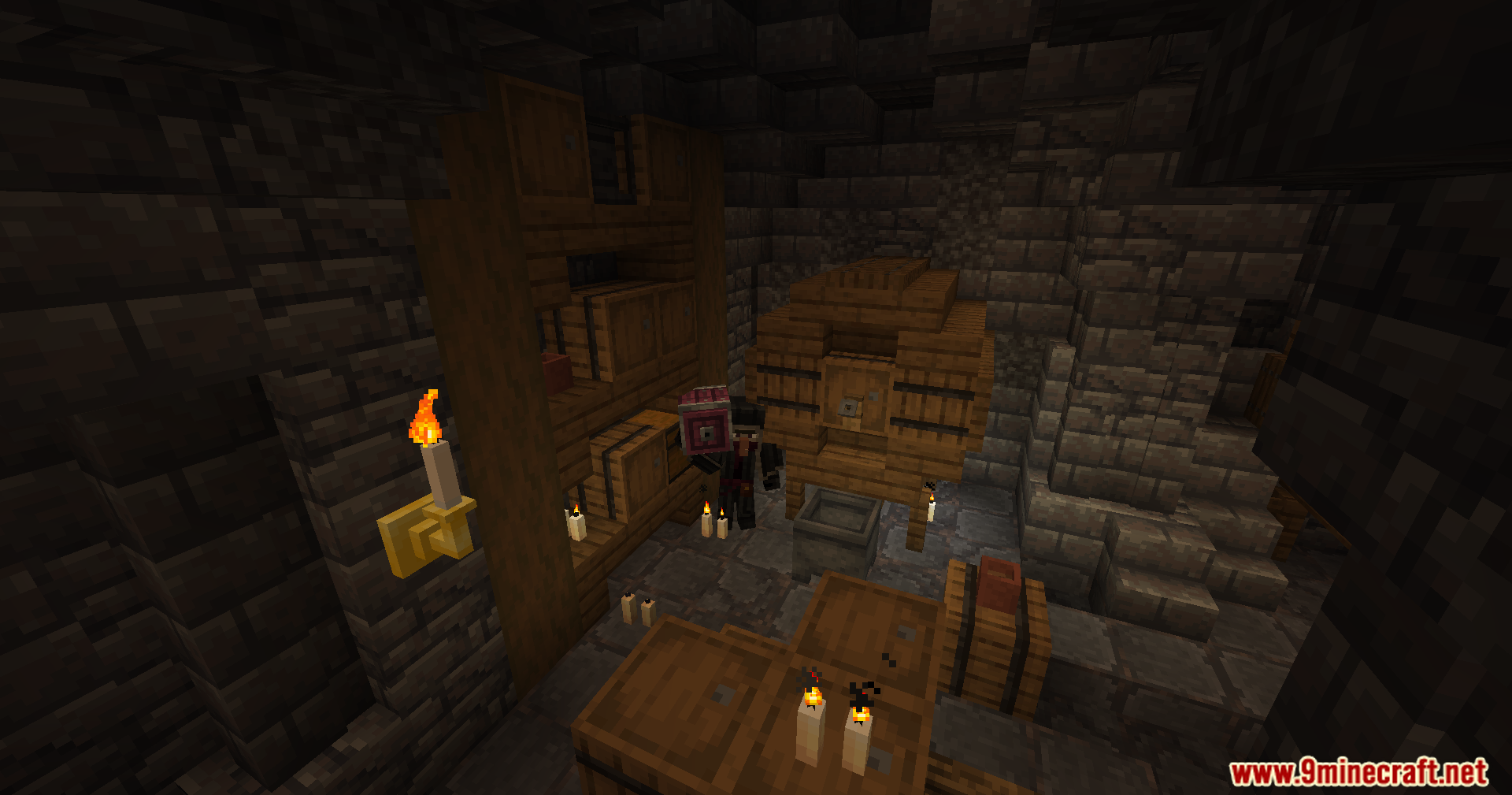 A player character holding a structure box inside a dark stone cellar
