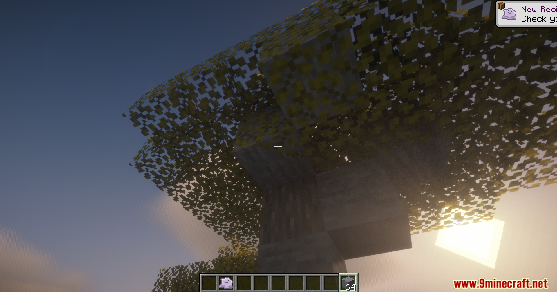 Disguising tree leaves as stone blocks using a special camo item in Minecraft