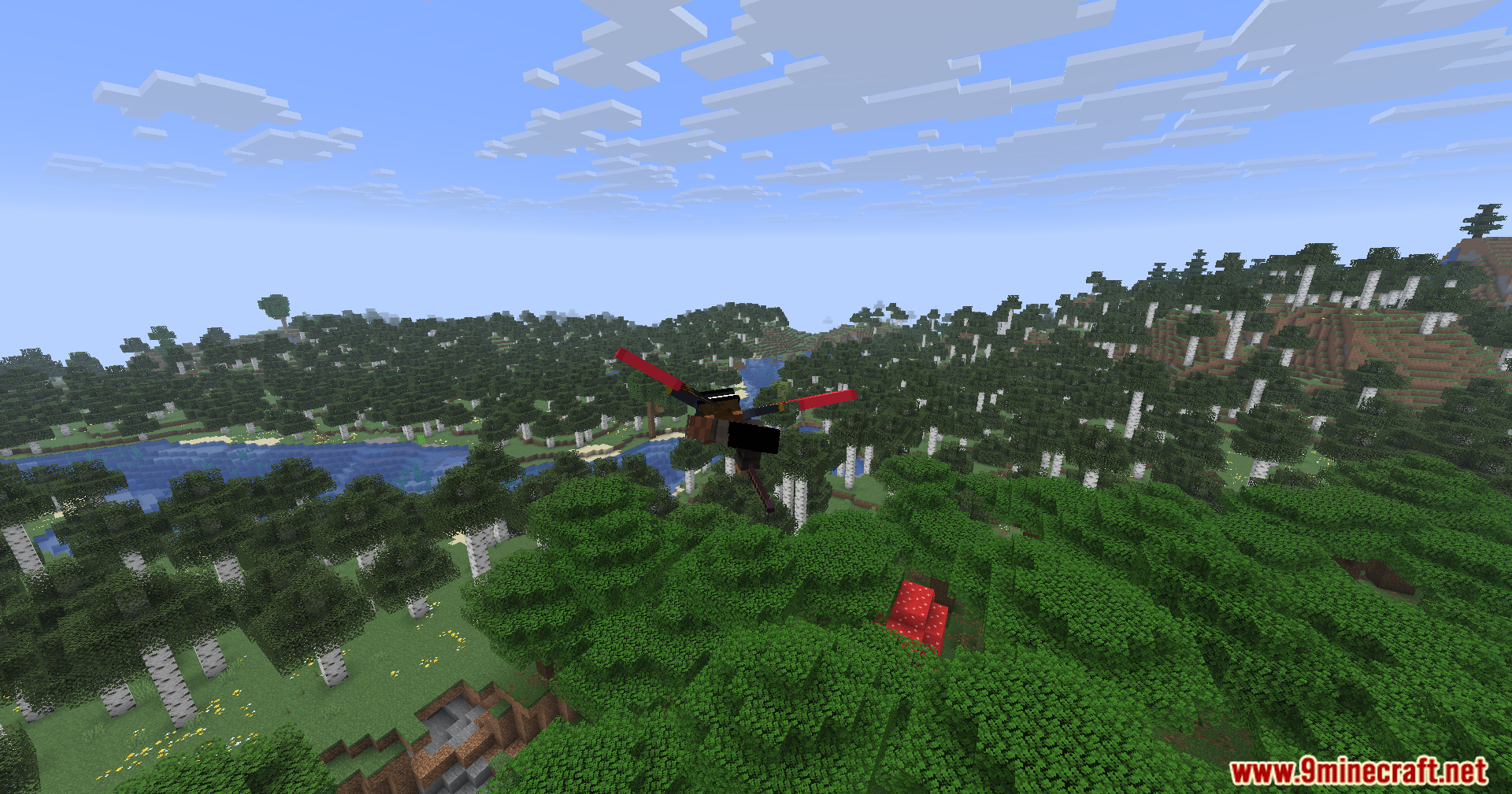 Carpet Pvp Practice Mod Screenshot 7 Minecraft player glides with red elytra wings over a dense forest biome