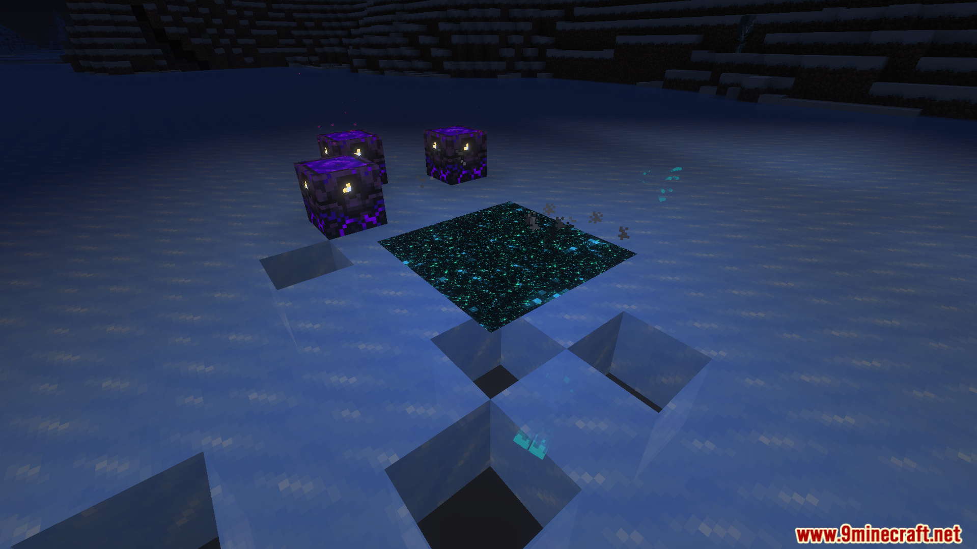 Glowing obsidian and end portal blocks placed on a frozen ice surface