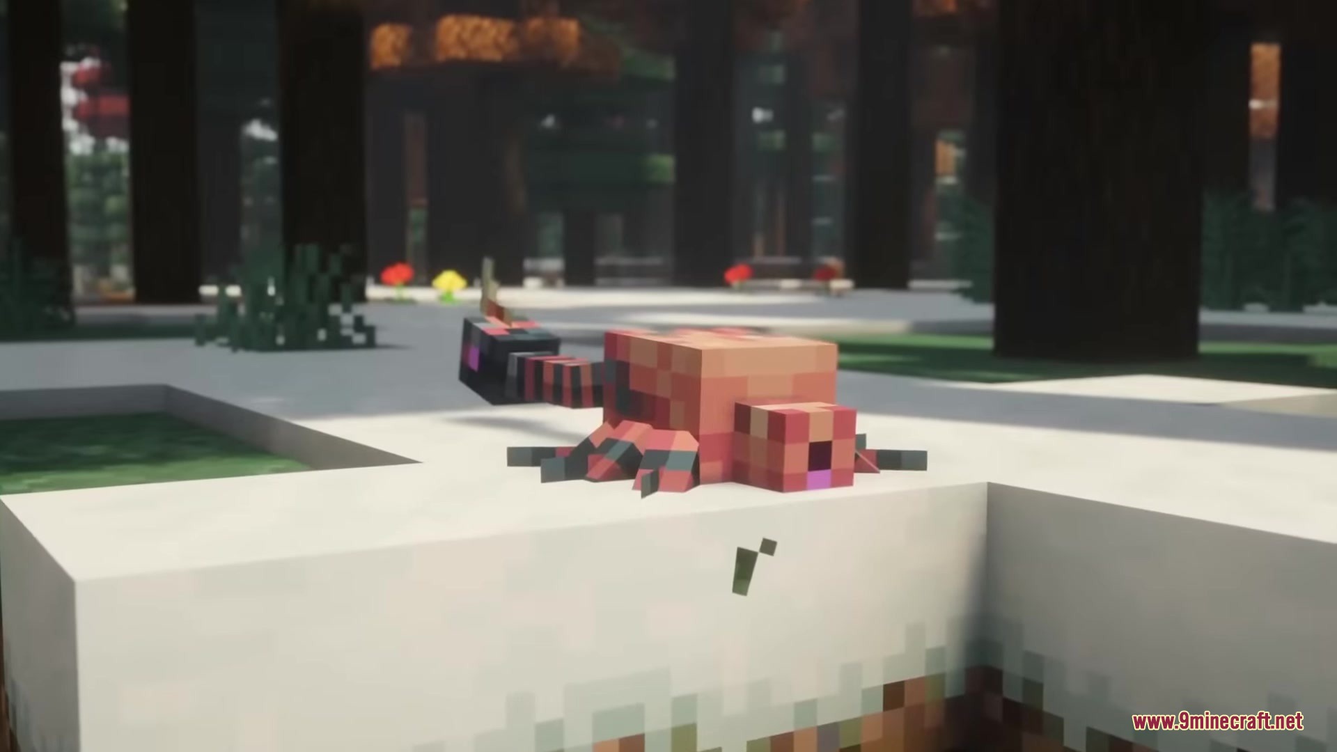 A small reddish techno flesh monster crawls on the snowy ground
