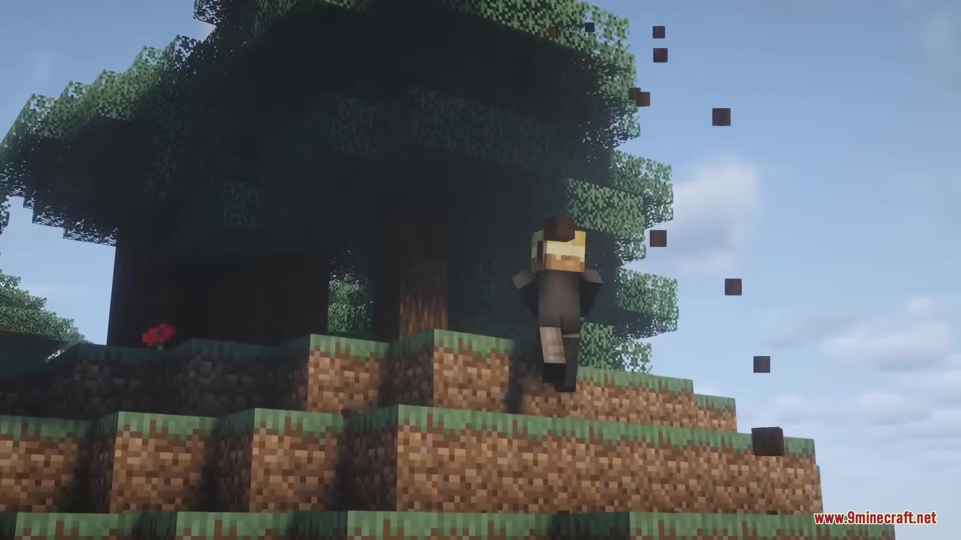 A player character running towards a large tree on a grassy hill
