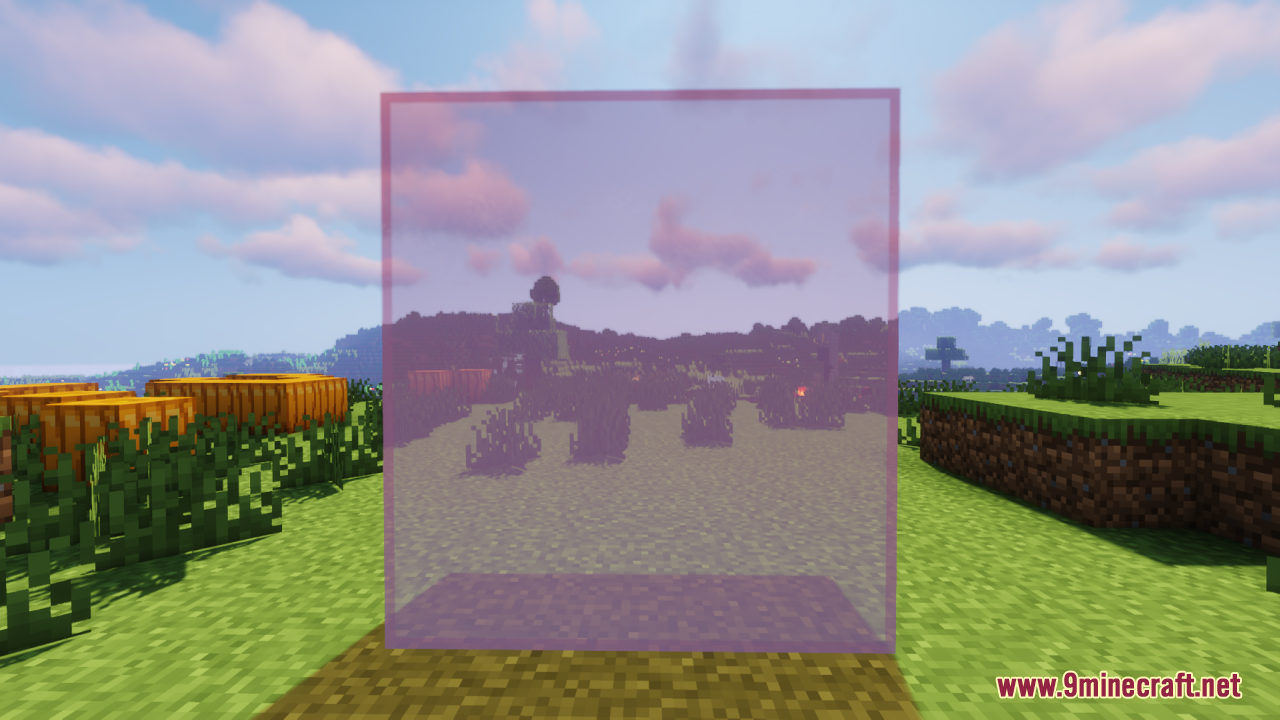 A clear purple glass block stands in a field with pumpkins nearby