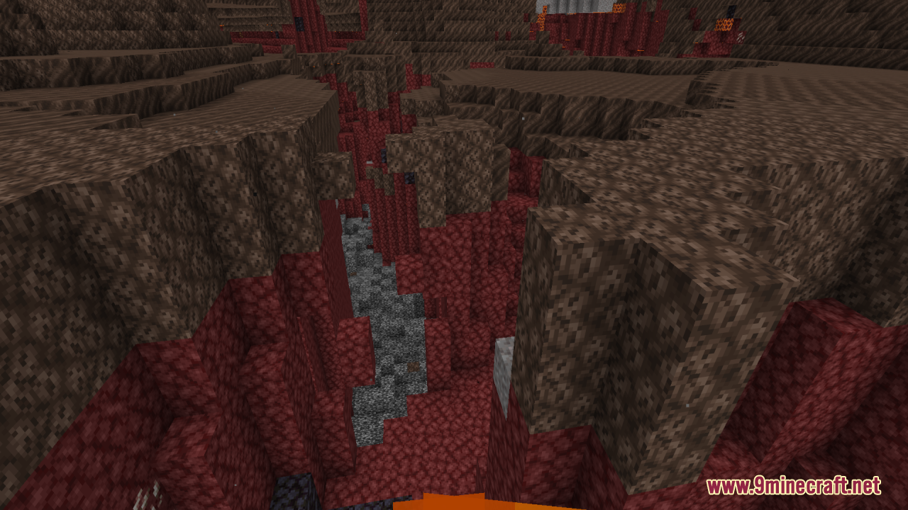 A deep Nether ravine with walls made of soul soil and netherrack