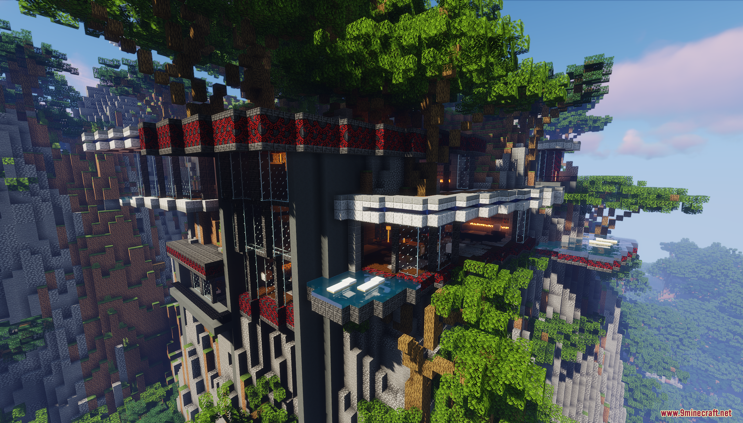 Modern mansion built into a cliff with glass windows and balconies