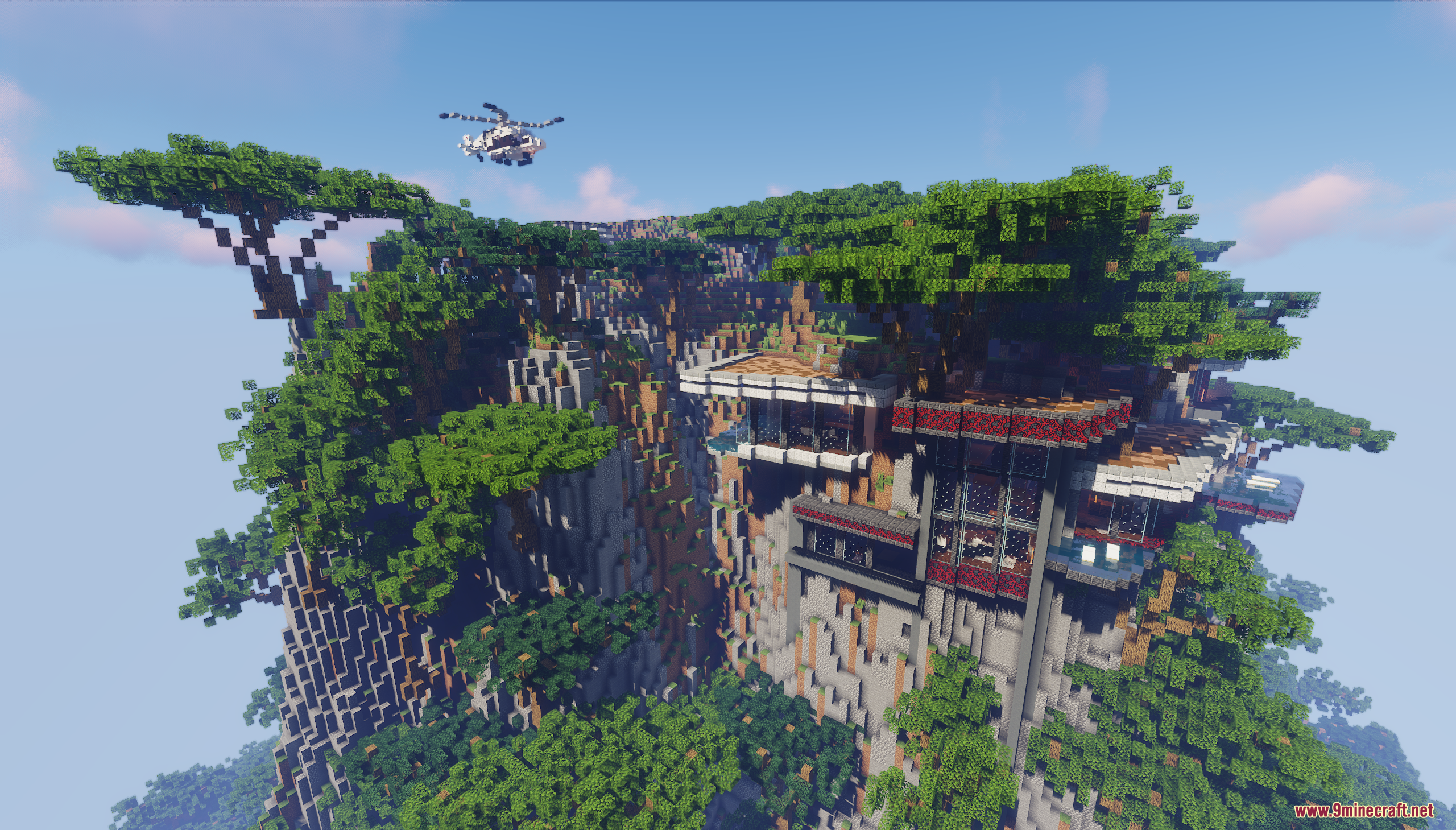 A modern mansion built into a cliffside within a lush jungle biome