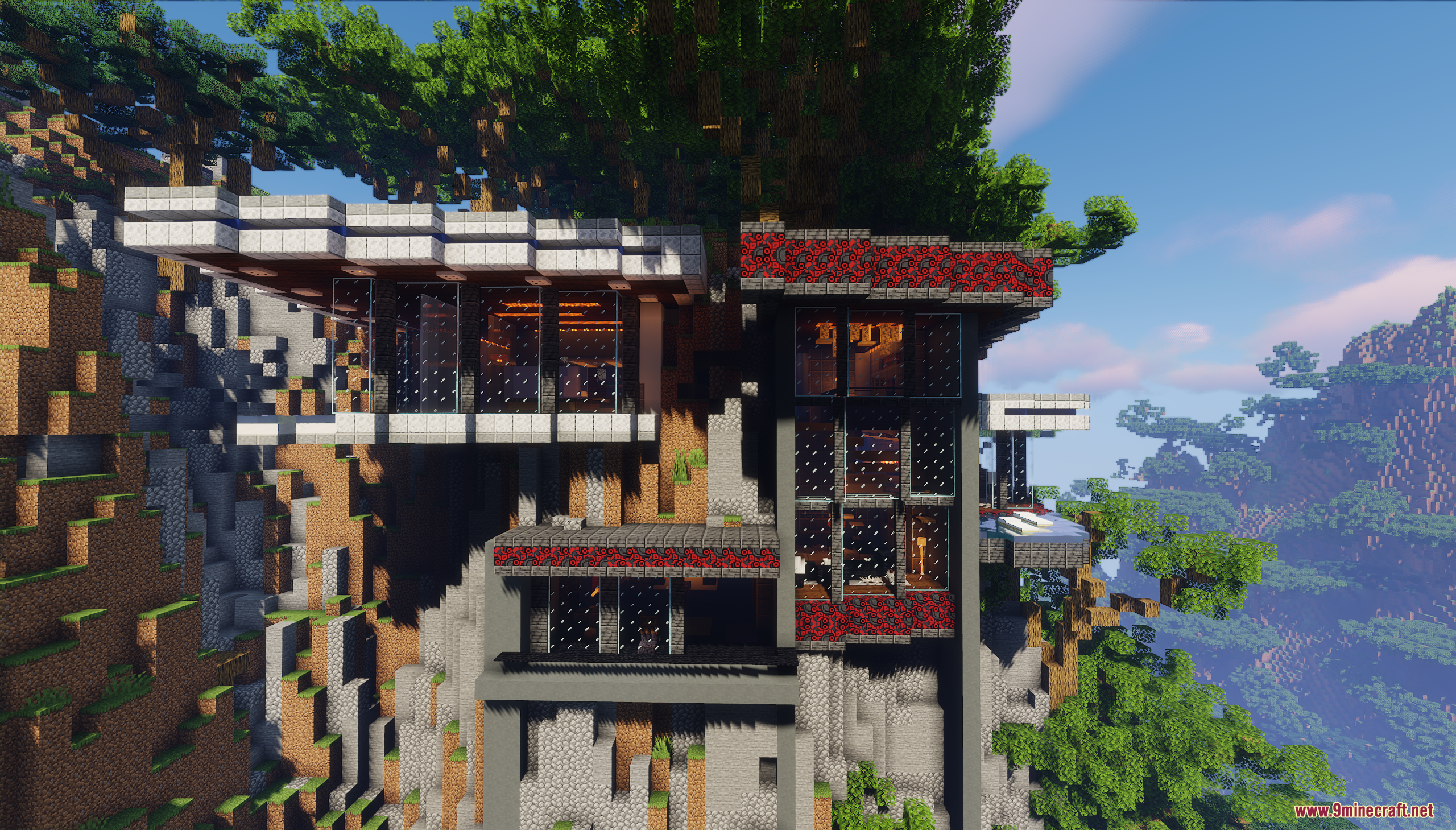 Close up view of a modern house with large glass windows and red accents