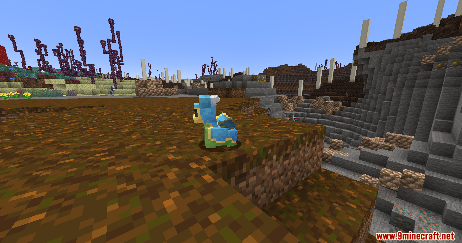 Cobble Safari Mod Screenshot 12 A blue and yellow Cobblemon stands on a ledge in a unique dimension